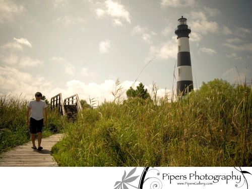 The Bodie Island lighthouse and beau walking