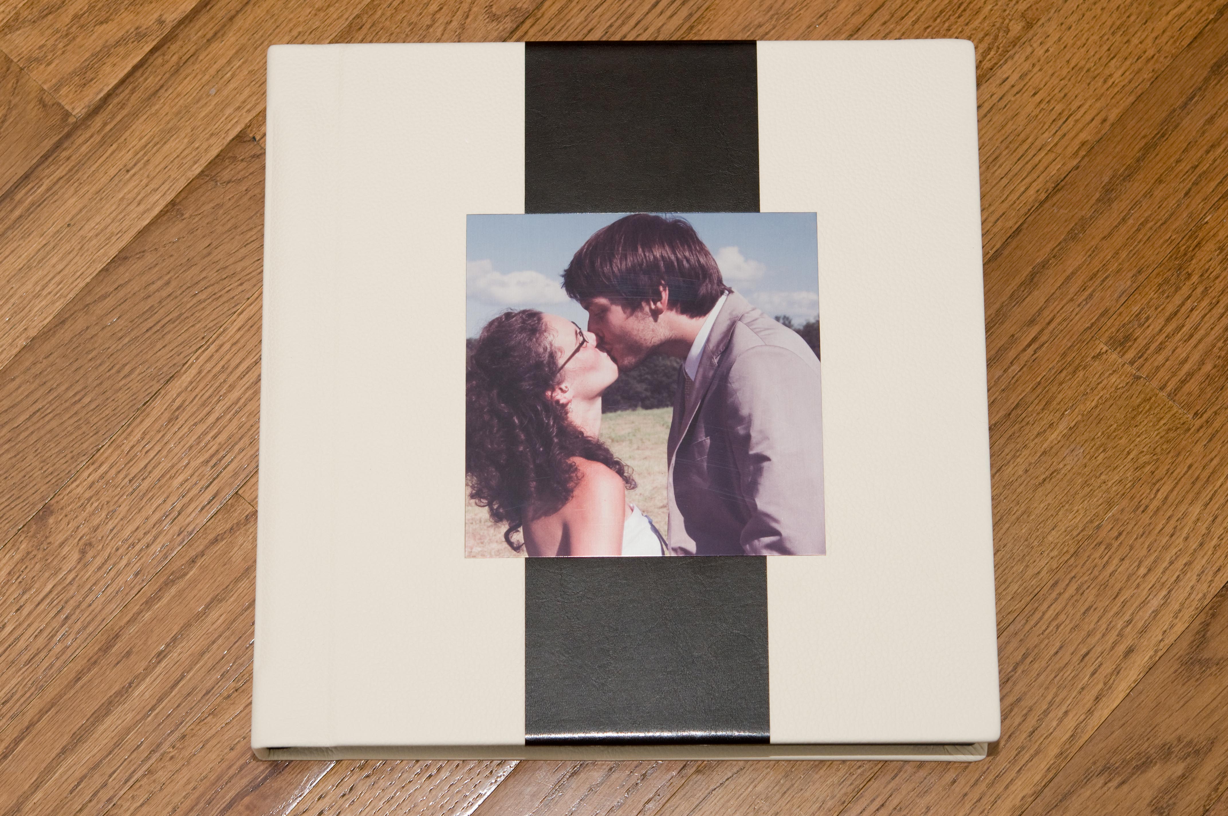 Custom cover for the 12x12 album. Pearl Italian leather, Smooth black accent leather and custom metal cameo