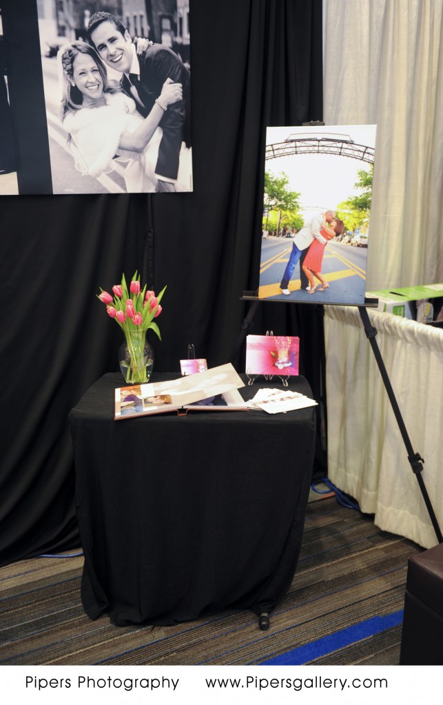 Shot of the back table with the 8x10 album and canvas, Columbus Bridal Show - Pipers Photography