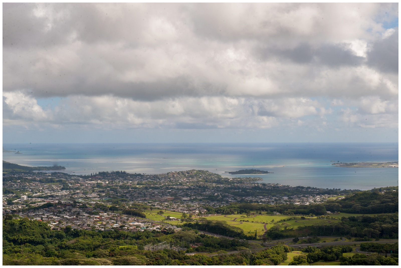 Looking out to the ocean from Pali Lookout with the cliff and bees on Oahu hawaii