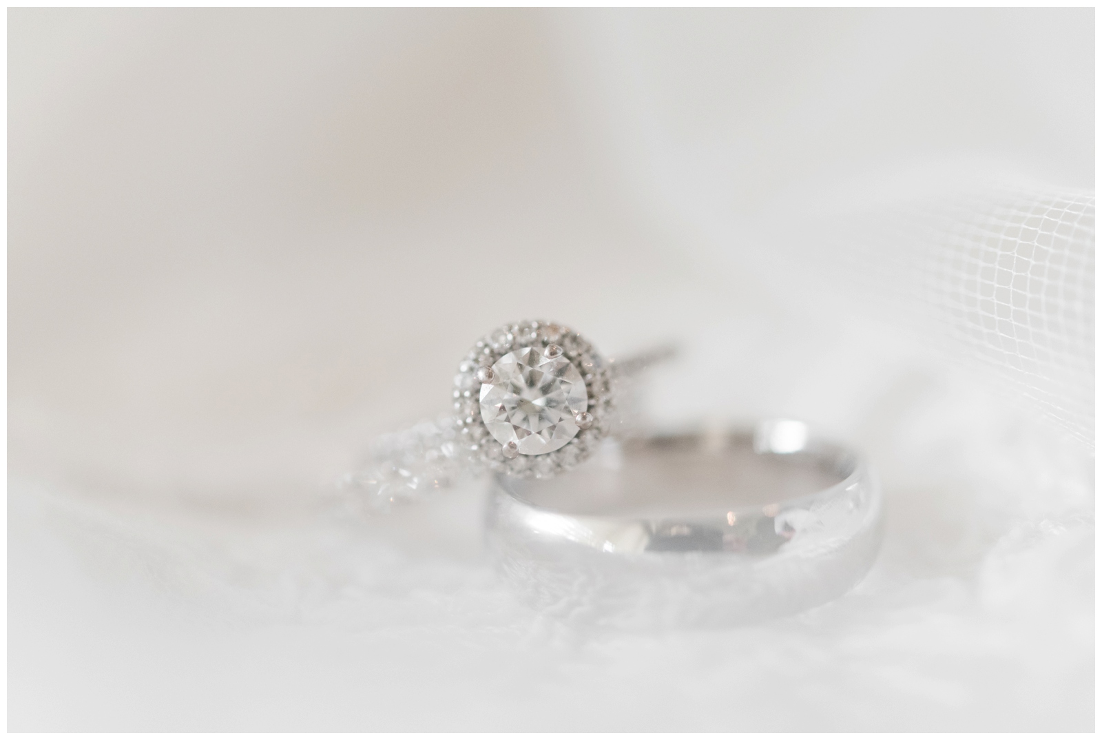 diamond engagement ring sits on wedding band during Ohio wedding day preparations