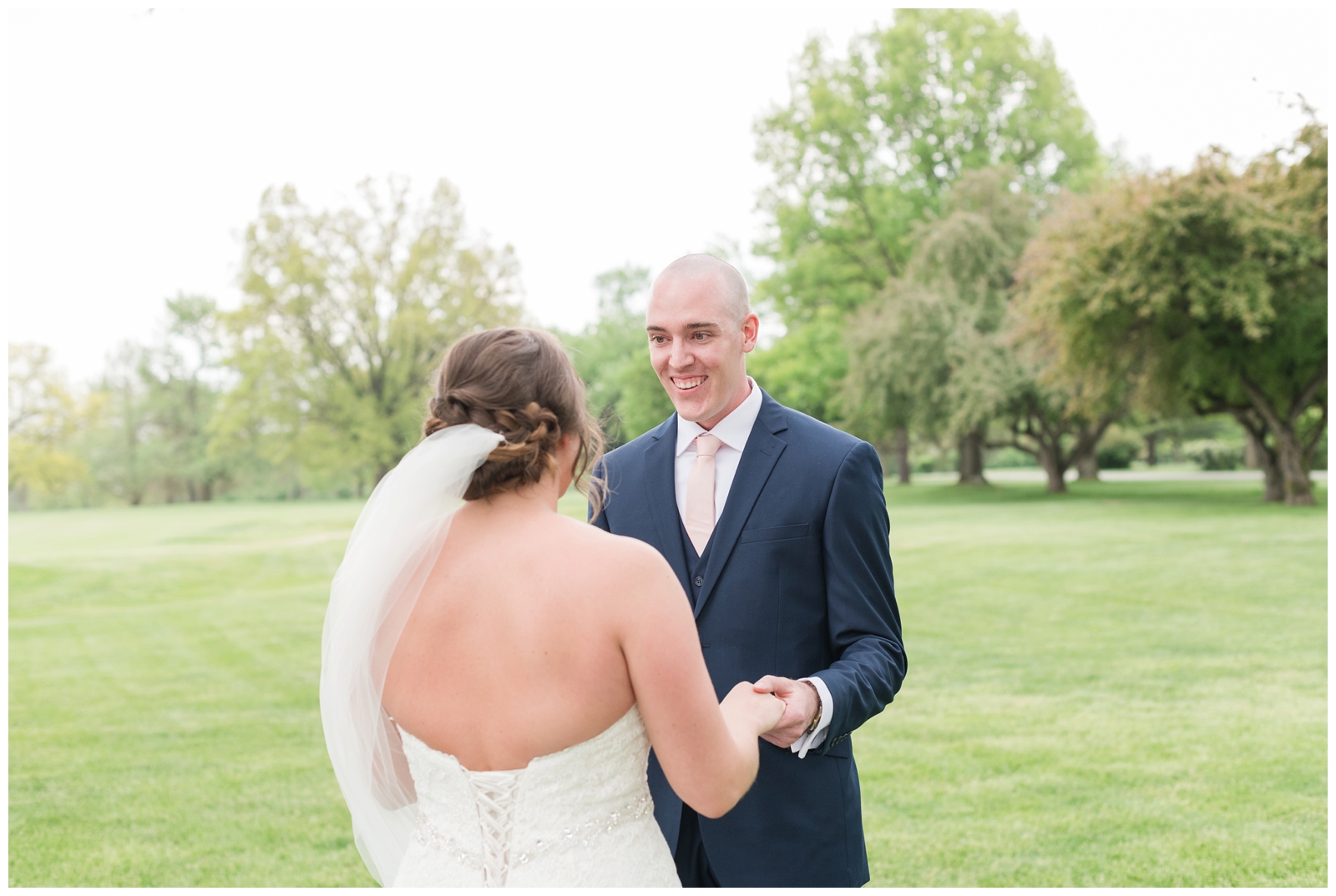 groom sees bride for the first time during first look at Columbus OH wedding