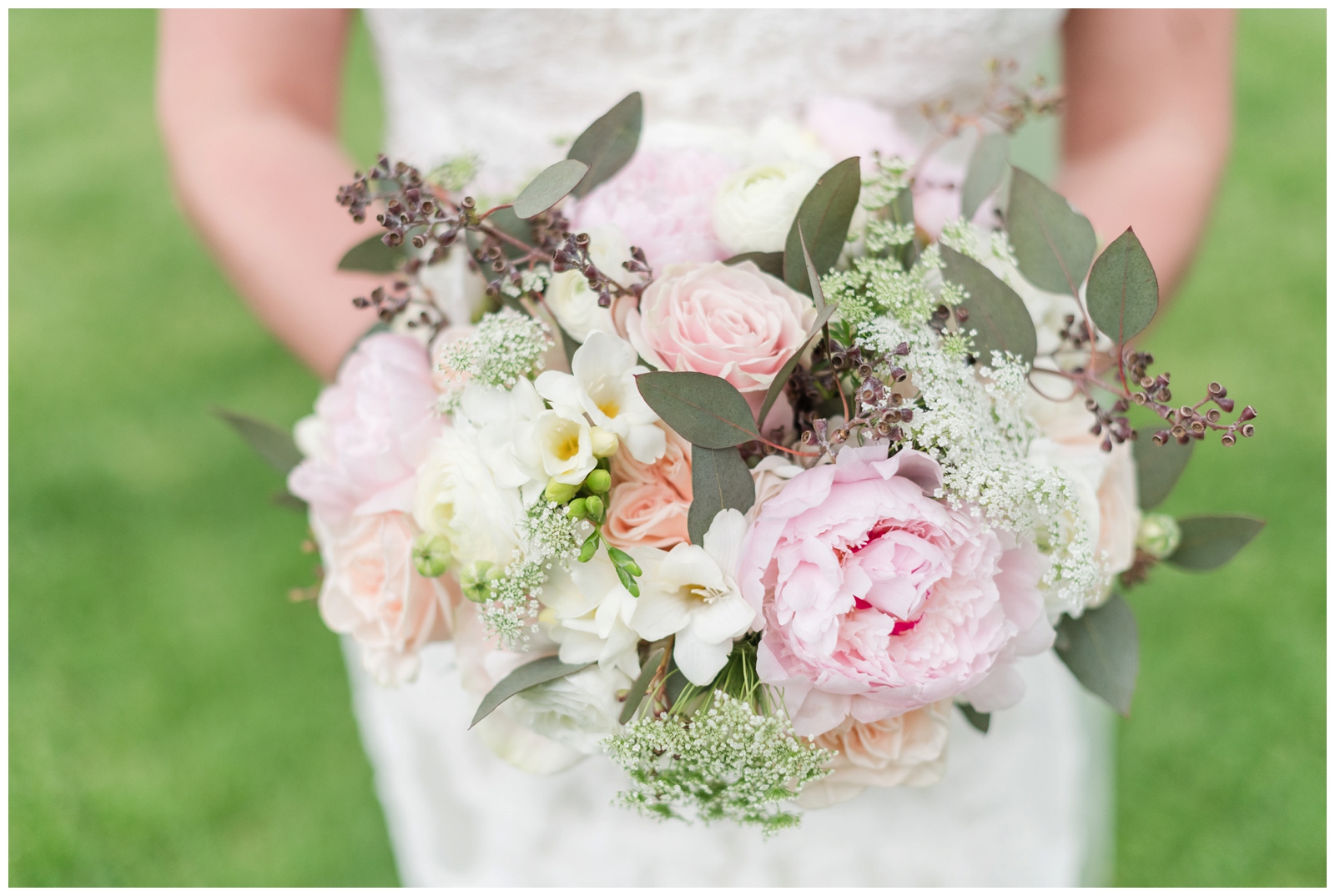 wedding bouquet with pink peonies, pink roses, and white flowers plus greenery by Madison House Designs
