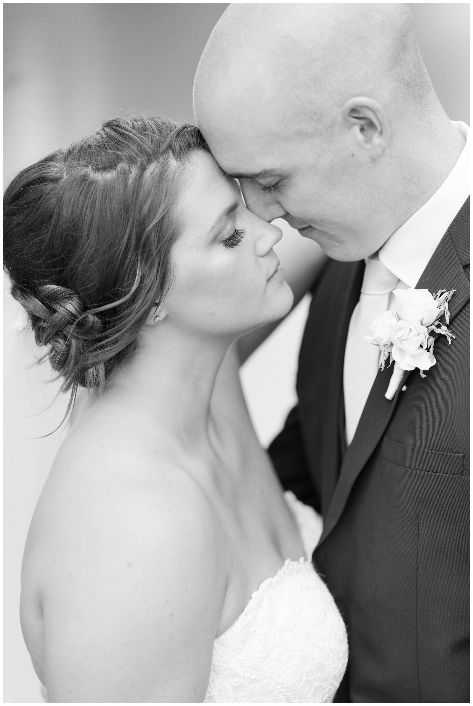 dramatic black and white portrait of bride and groom up close on wedding day in OH