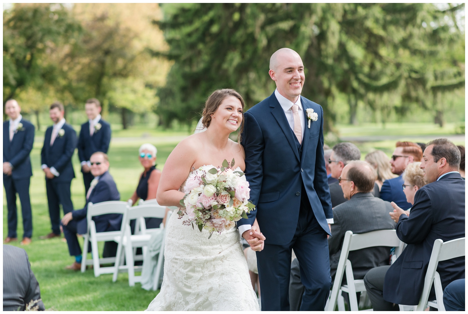 bride and groom leave outdoor wedding reception at Brookside Golf and Country Club