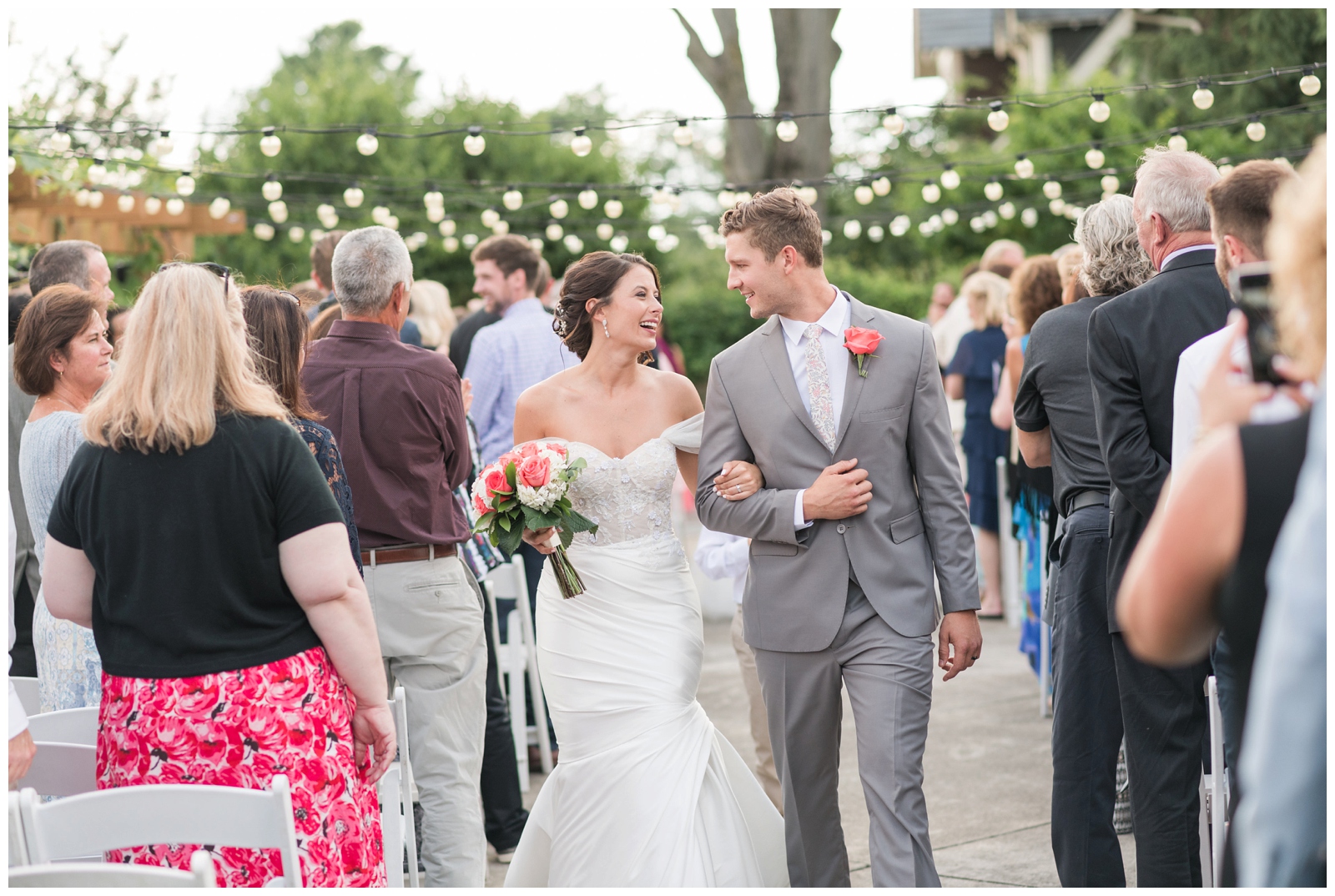 bride and groom walk up the aisle after getting married at Franklin Park Conservatory