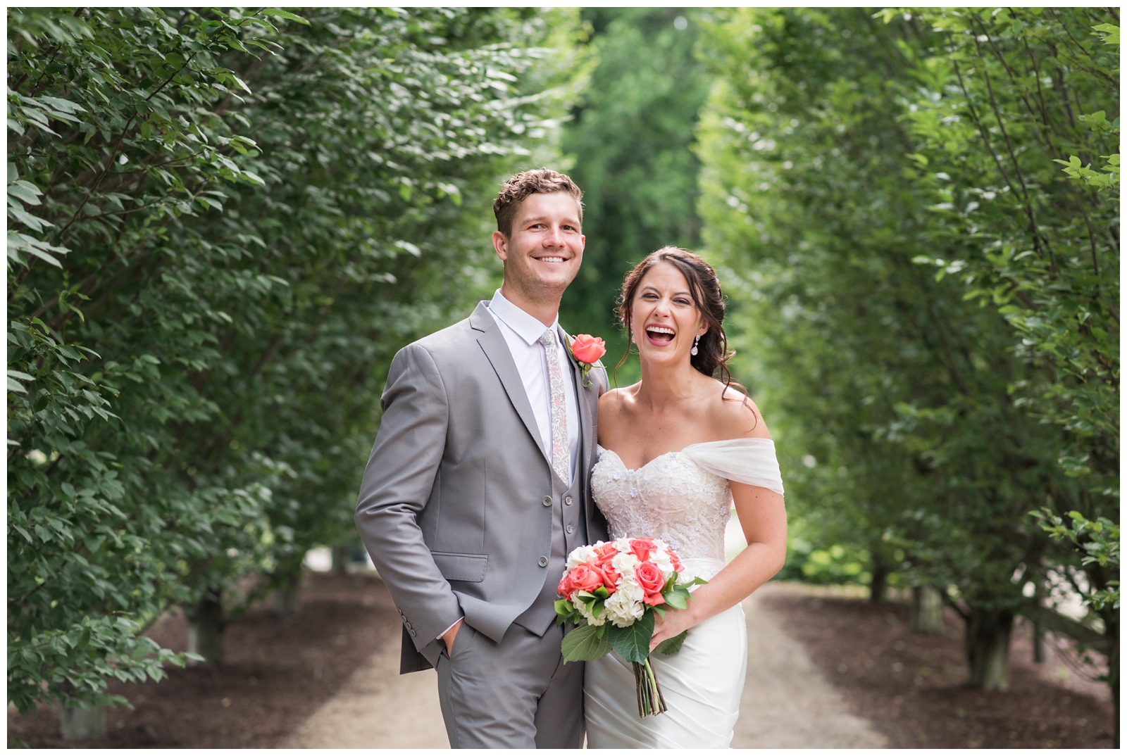 bride and groom laugh together during wedding portraits in Columbus OH