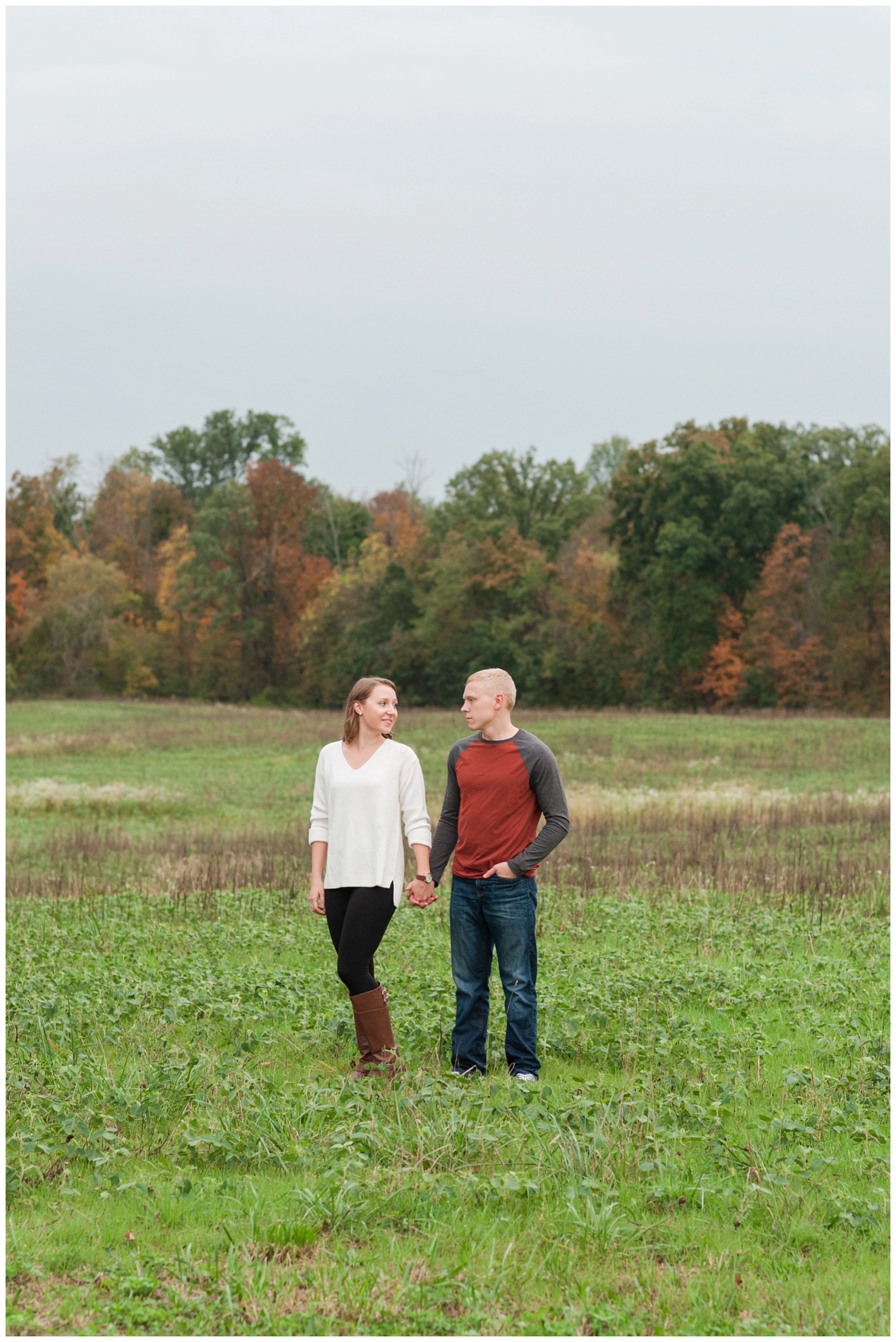 engaged couple looking at each other during theirCountry Engagement Session Sunbury Ohio