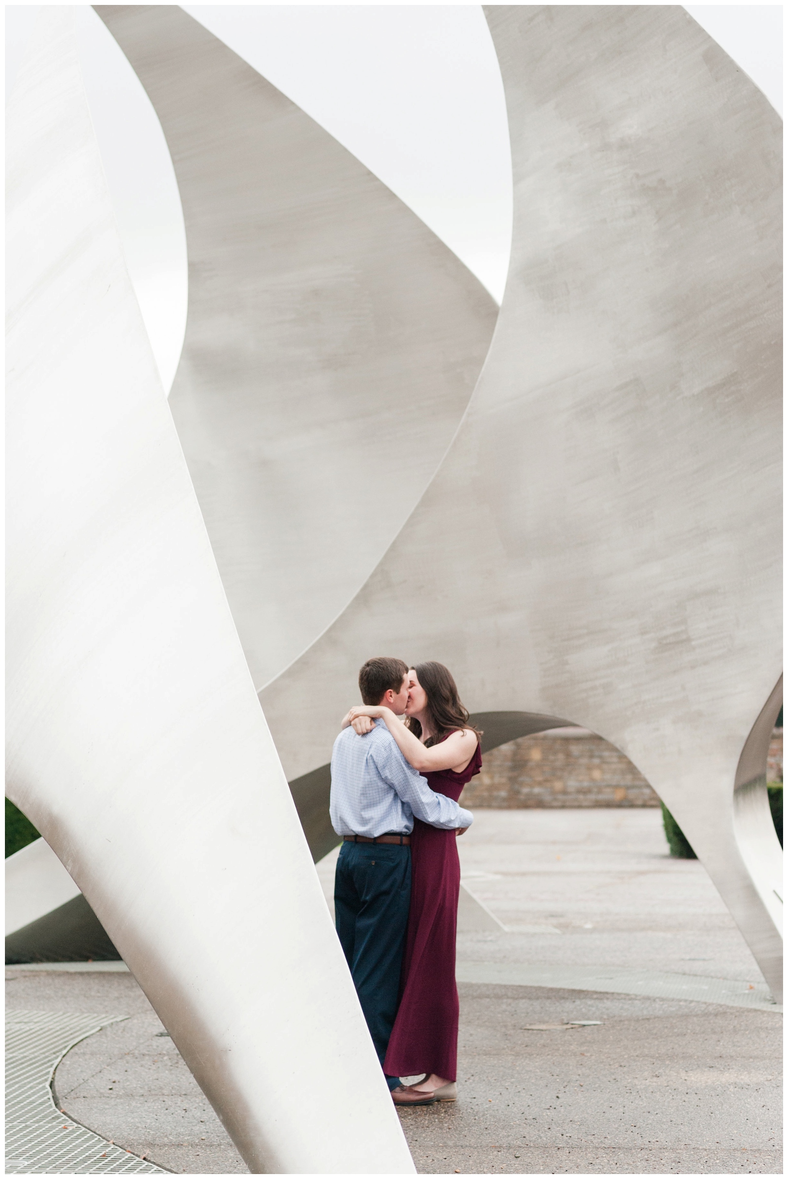 engaged couple kissing at franklin park conservatory in columbus ohio during the fall 