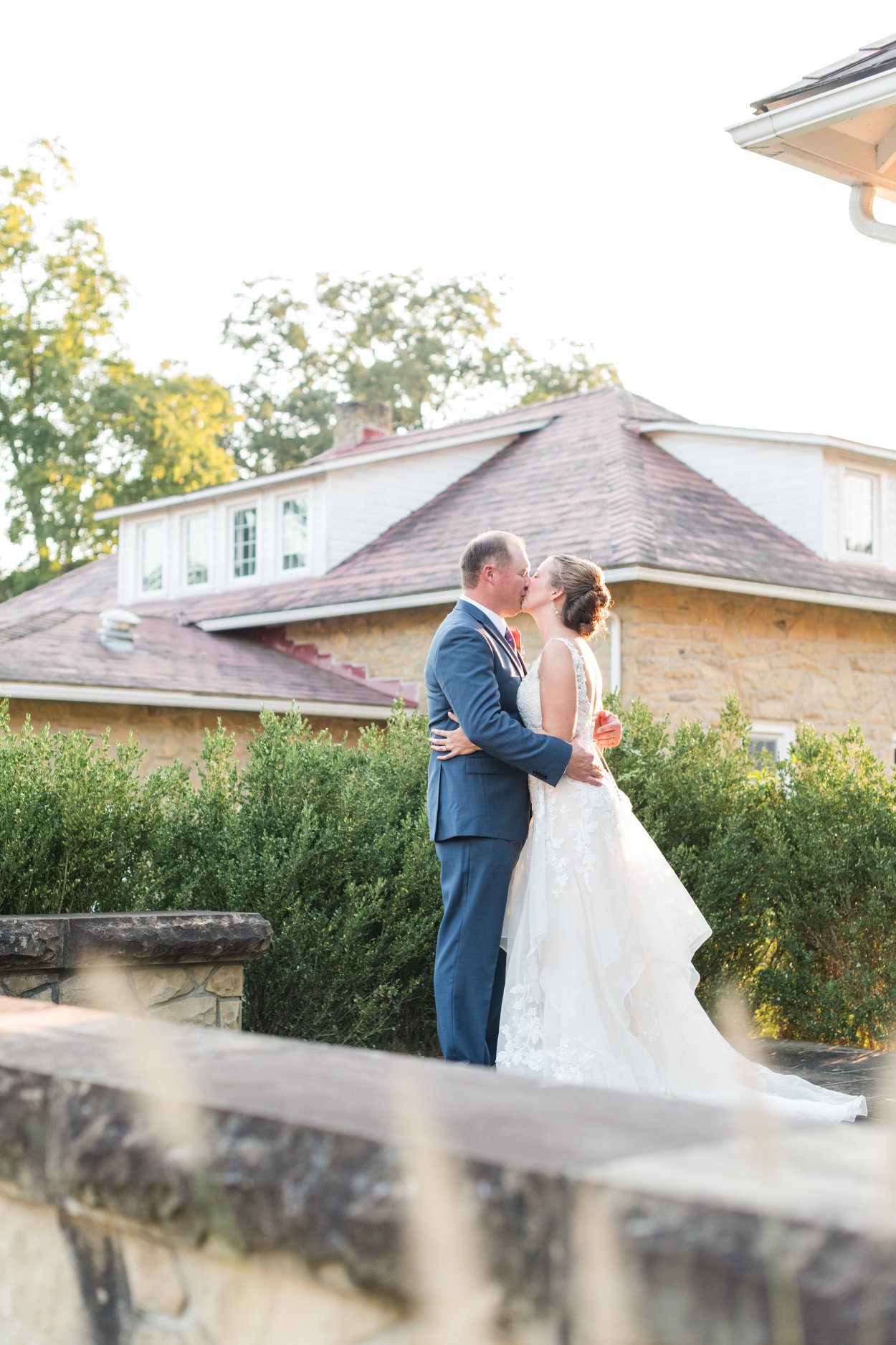 bride and groom kissing on their wedding day at bryn due mansion in granville, ohio columbus ohio luxury wedding photographer