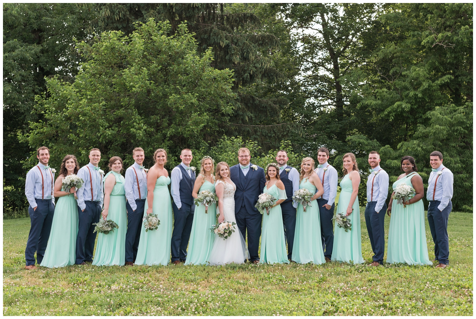 bridal party poses at EagleSticks Golf Club in mint gowns