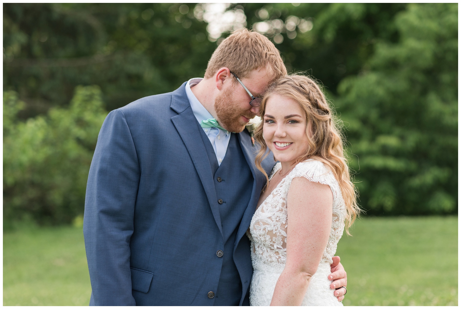 groom and bride snuggle during Ohio wedding portraits at EagleSticks Golf Club