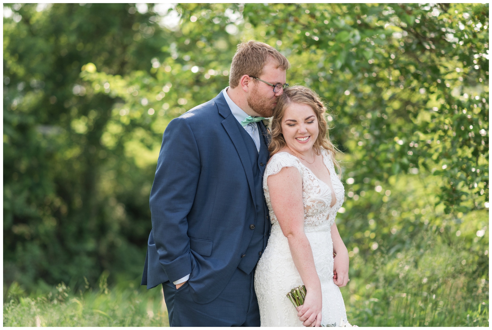 bride and groom laugh during wedding portraits in Ohio