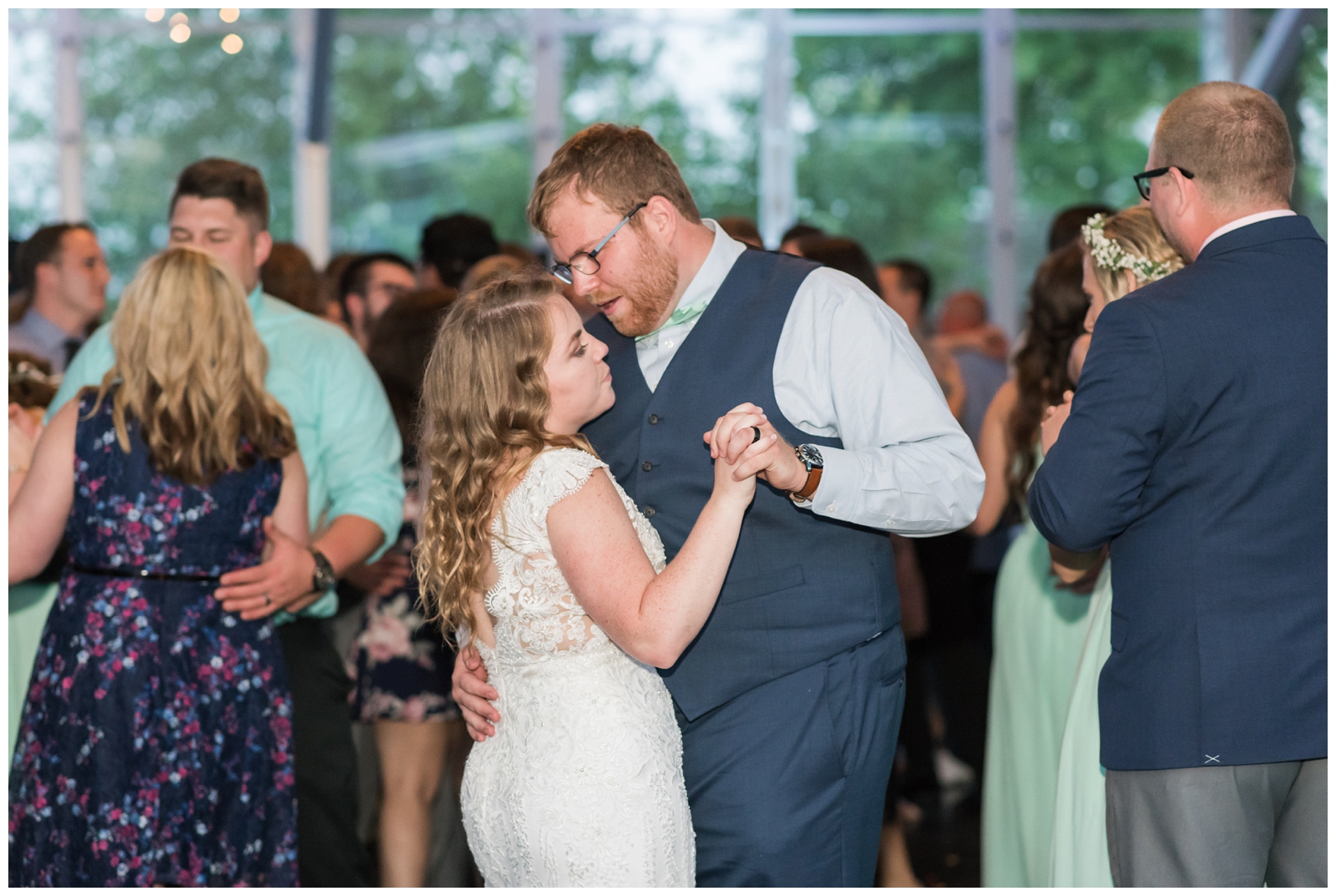 bride and groom dance with guests during reception at EagleSticks Golf Club