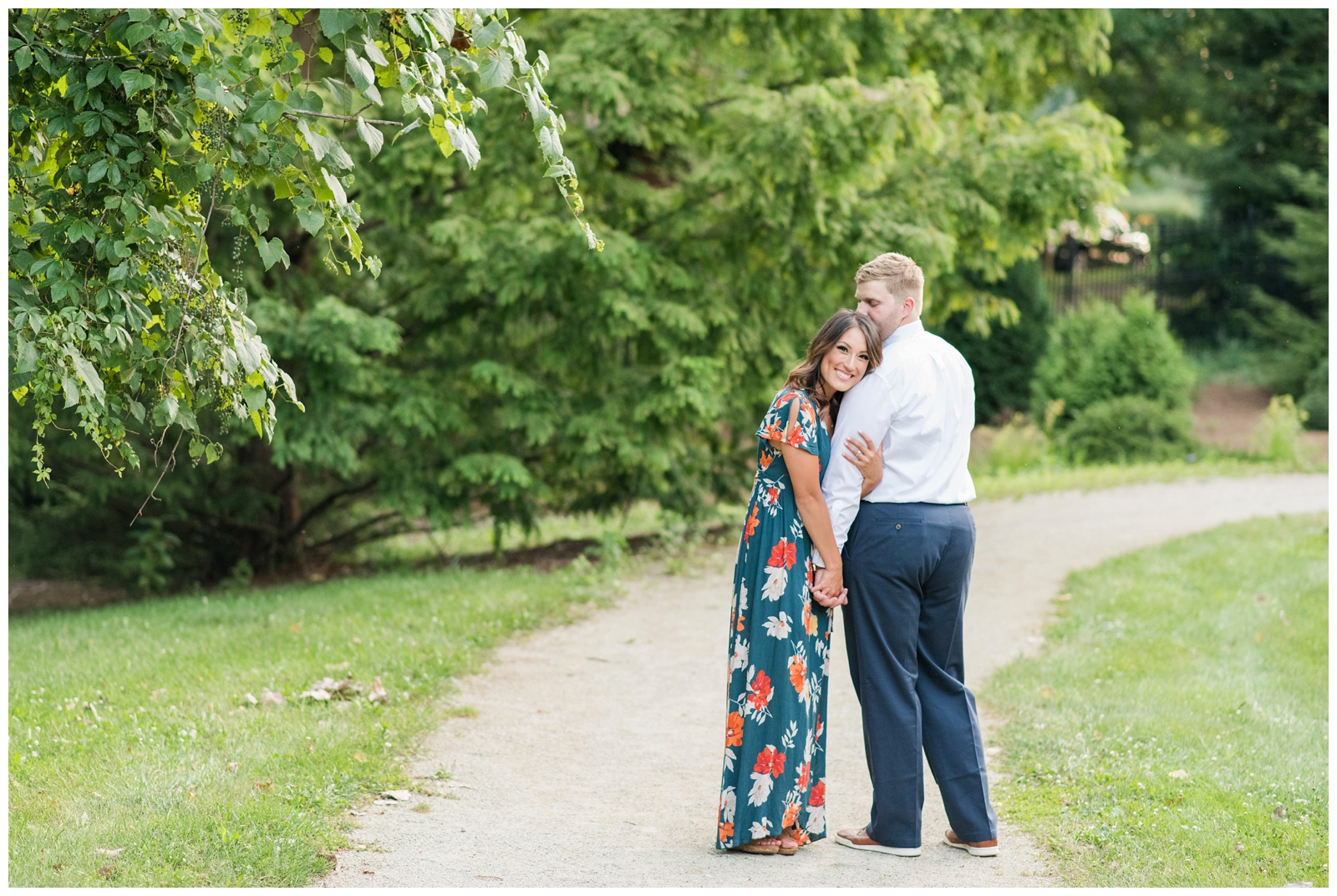 woman snuggling up to fiance during engagement photos 