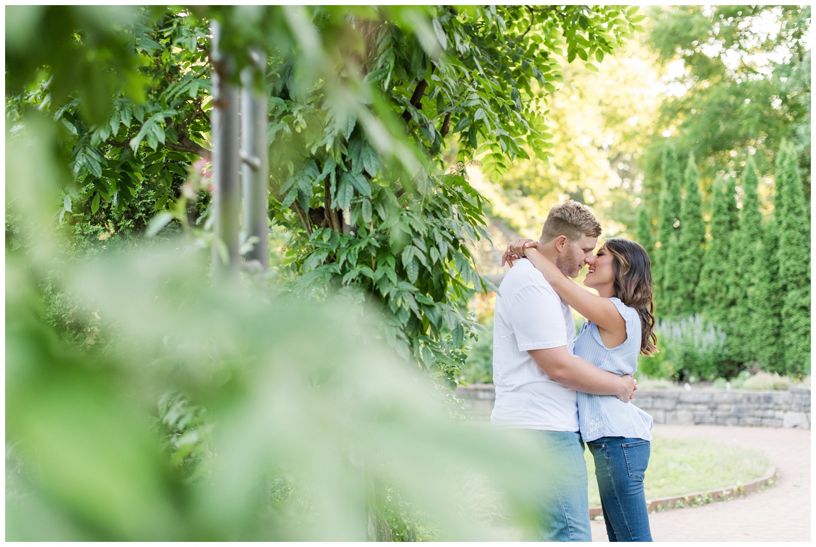 engaged couple happily almost kissing during their engagement session at Inniswood metro gardens Engagement Session in westerville ohio