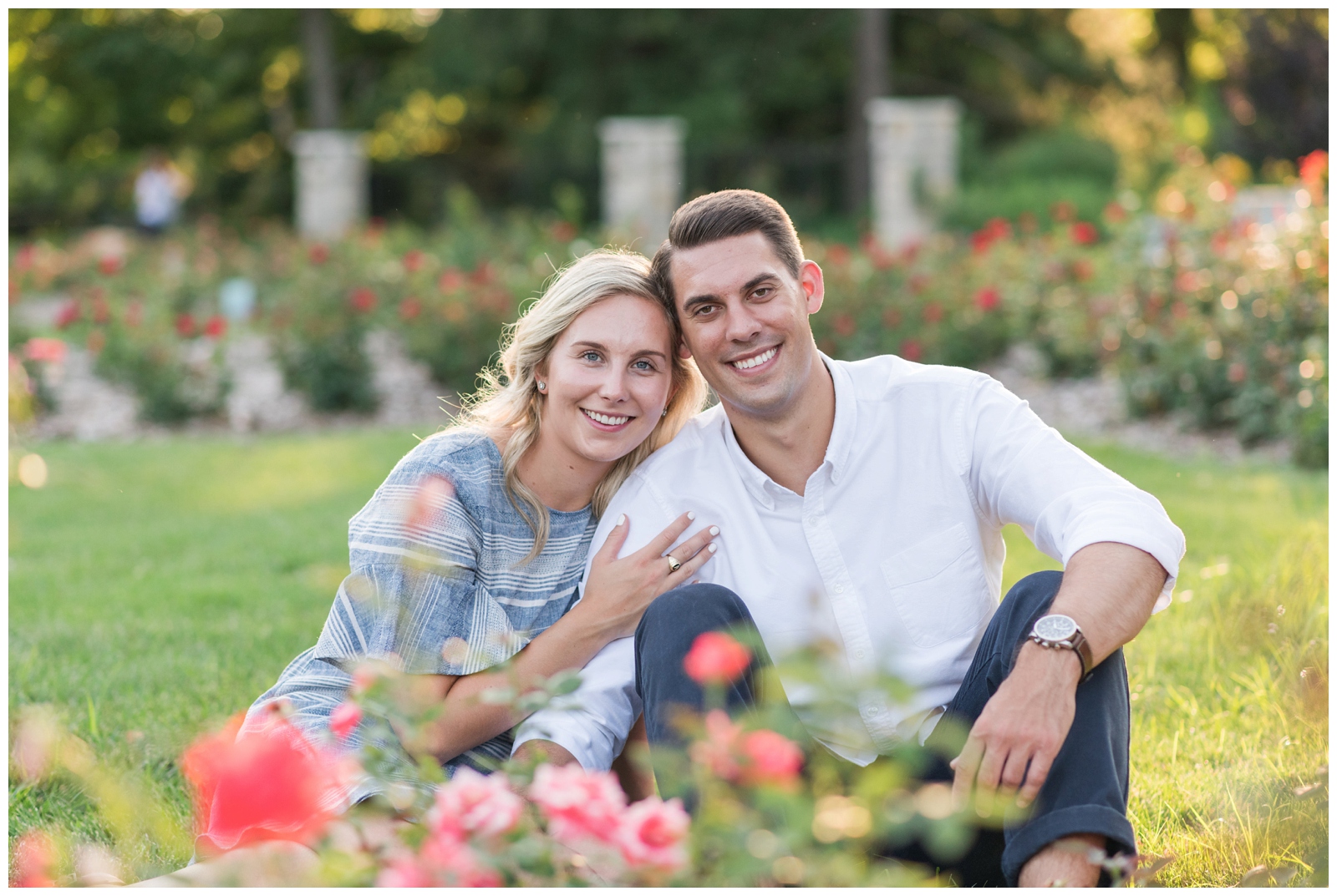 couple poses in garden during Park of Roses engagement session