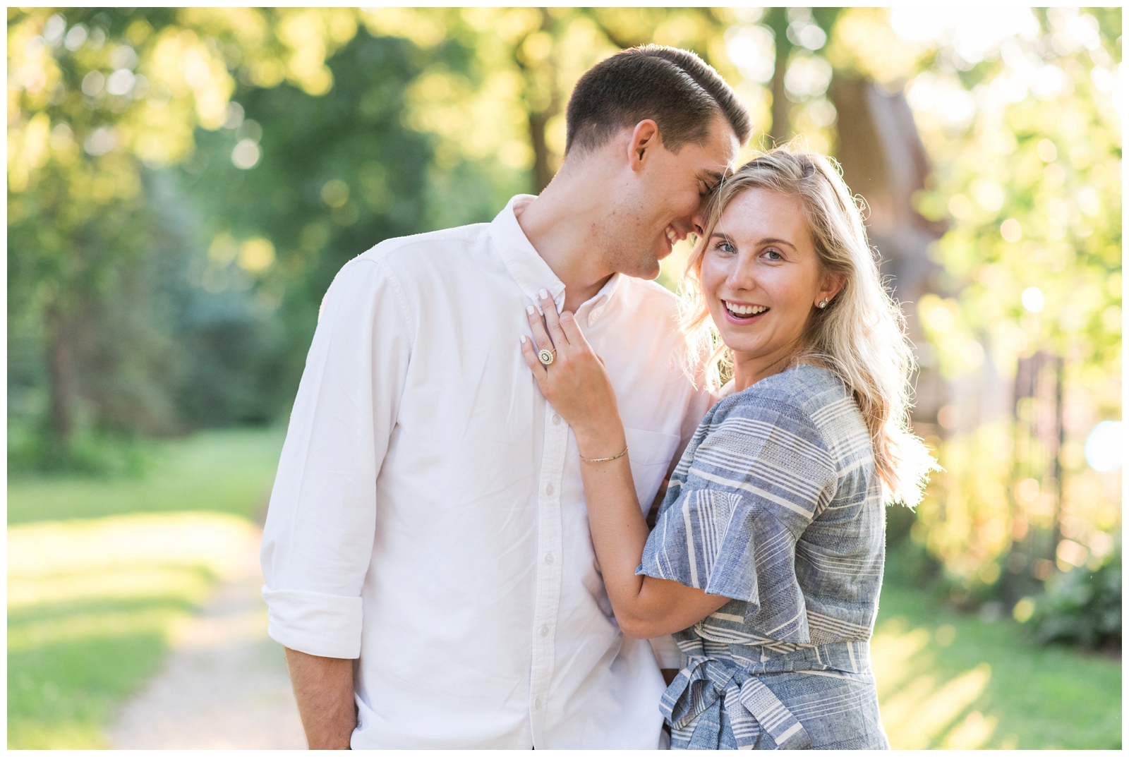 bride and groom to-be pose during engagement portraits at Park of Roses