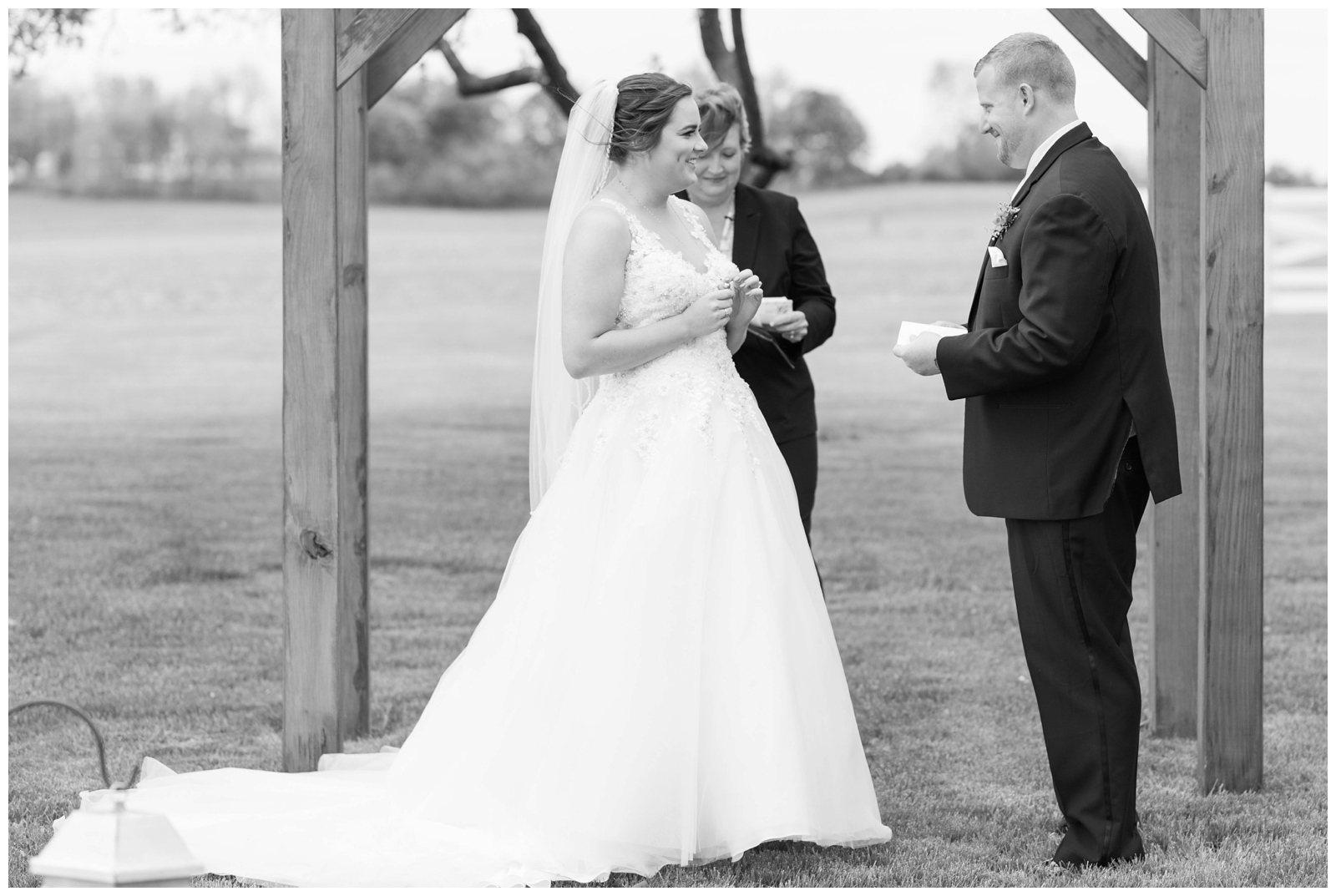 bride and groom exchange vows during outdoor ceremony at Pretty Prairie Farms