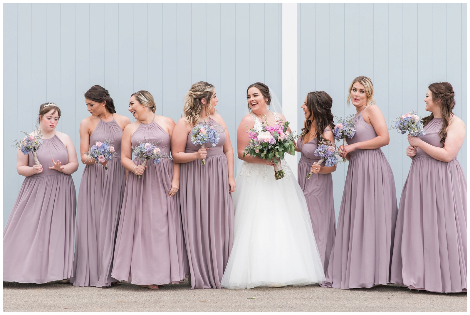 bridesmaids in pink laugh with bride at Pretty Prairie Farms