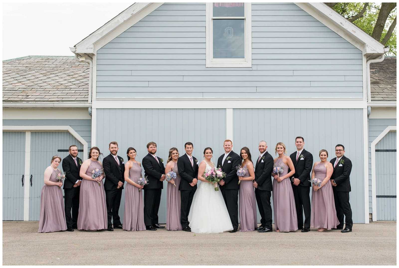 bridesmaids and groomsmen pose for OH wedding portraits