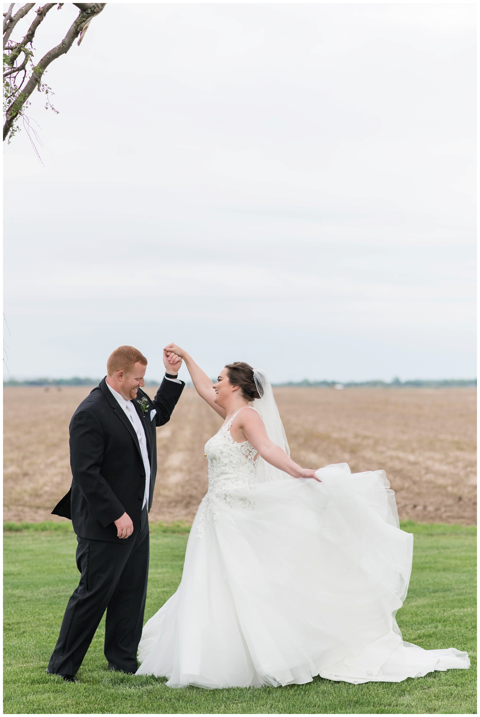 bride and groom enjoy a dance during wedding portraits