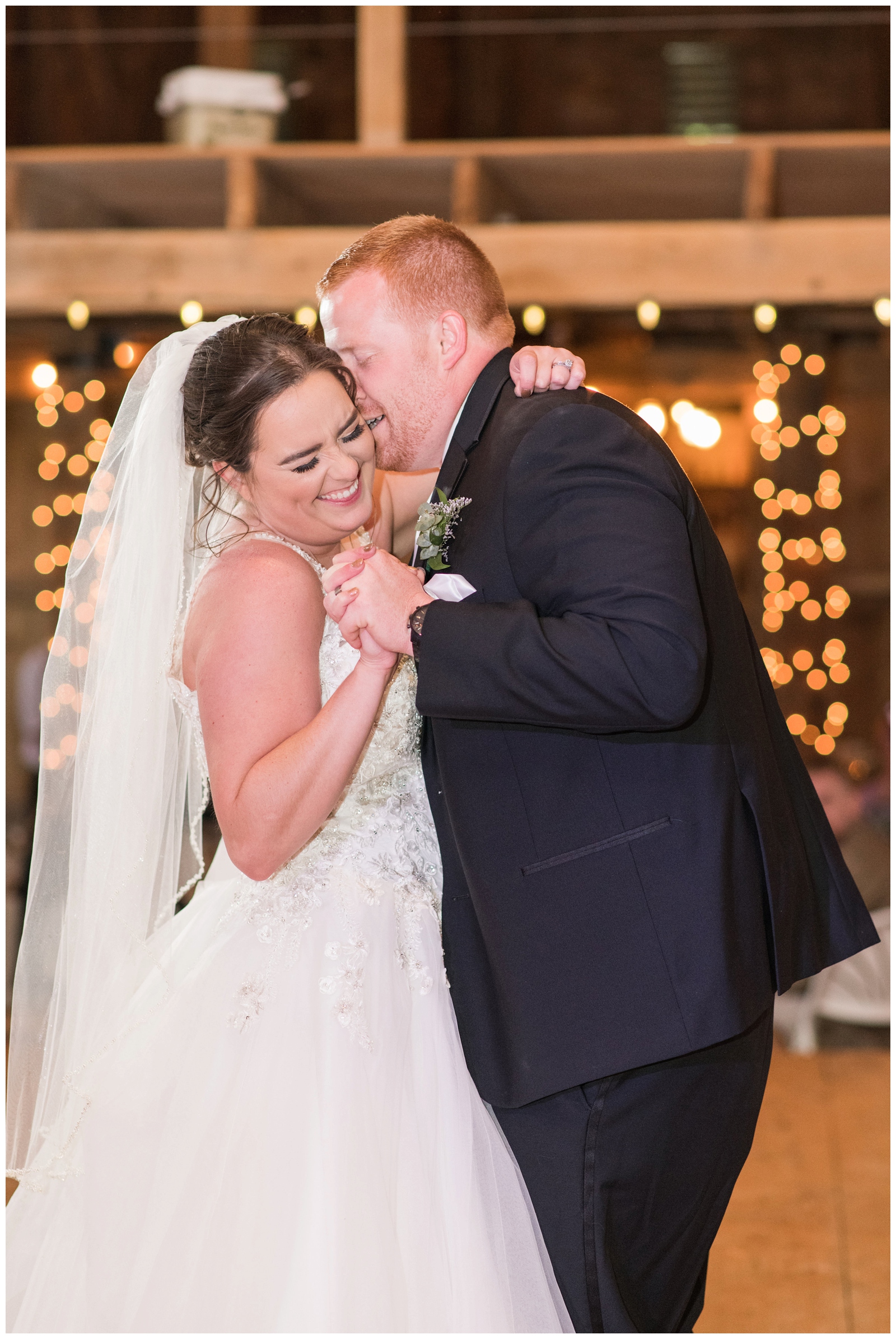 Bride and groom laugh during Urbana OH wedding reception first dance