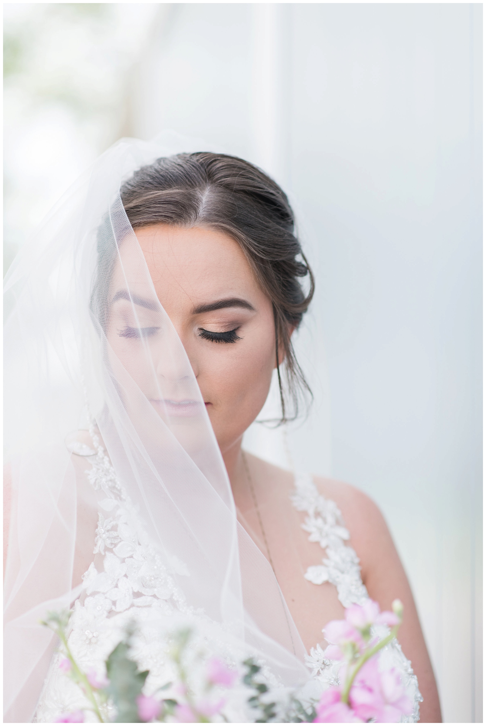 bridal portrait with veil and Madison James Designer wedding dress by Pipers Photography