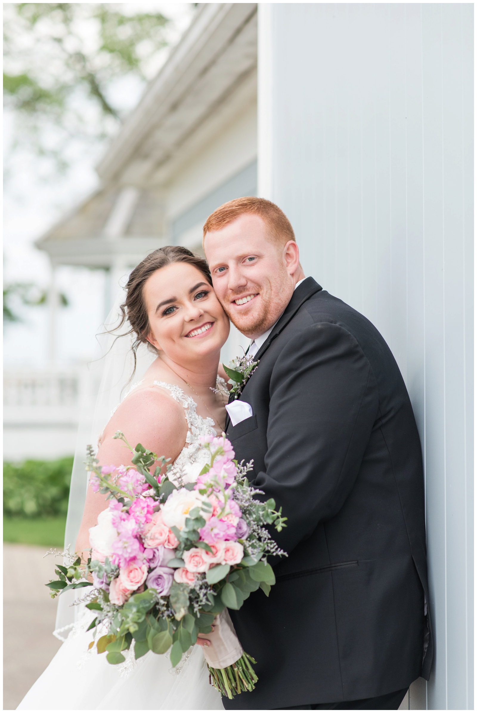 Bride and Groom are smiling together during their Ohio wedding day at Pretty Prairie Farms. 