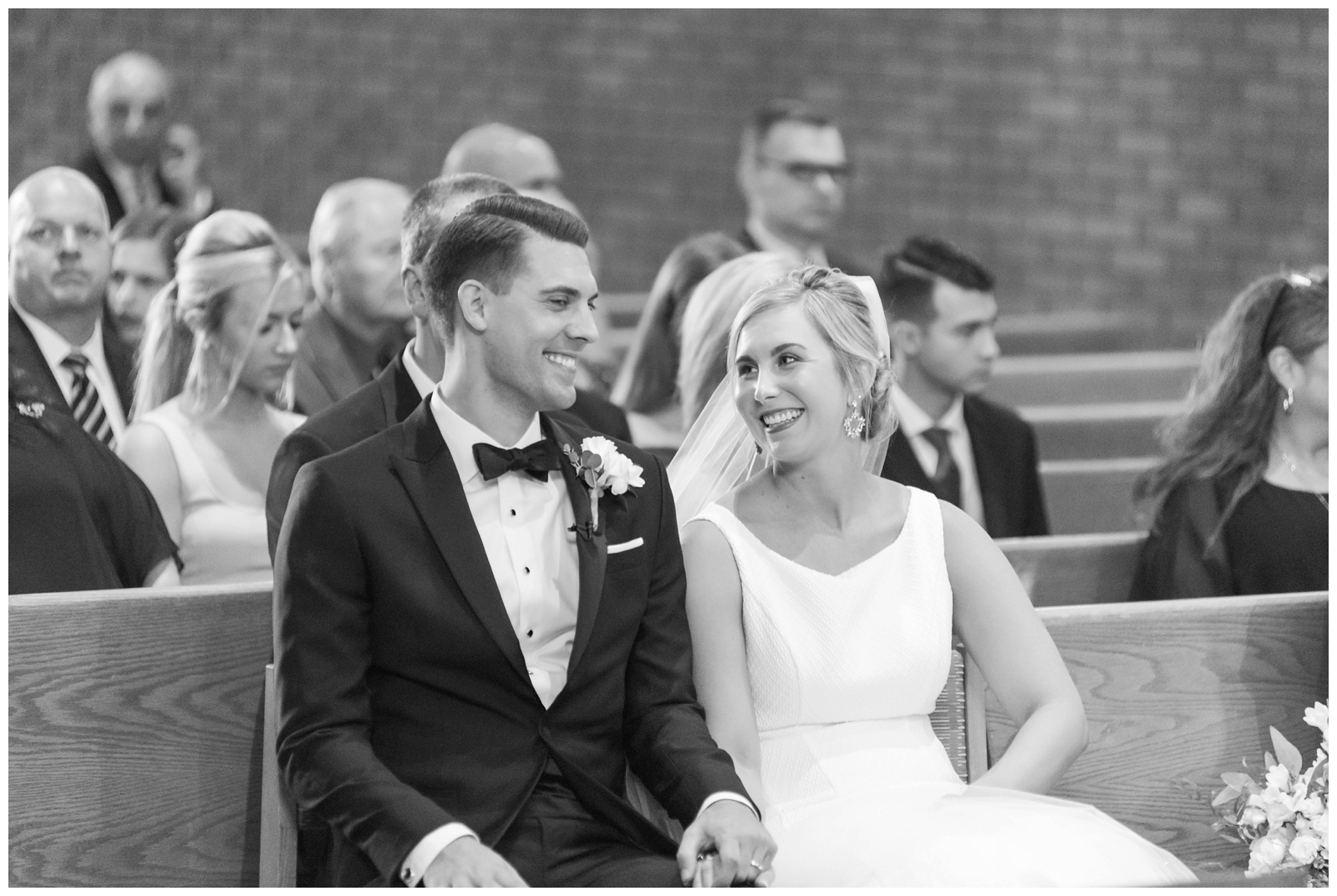 bride and groom smile at each other during wedding ceremony in Ohio