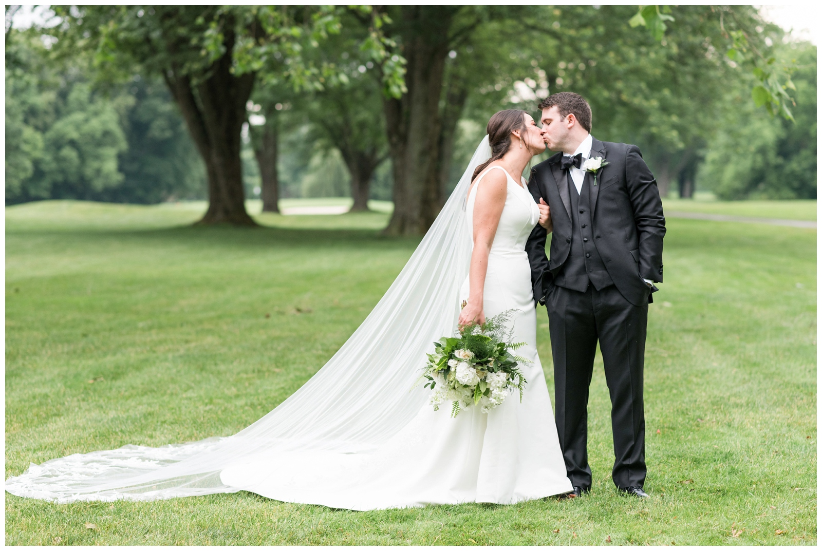 bride and groom kiss on Ohio wedding day at Brookside Golf and Country Club 