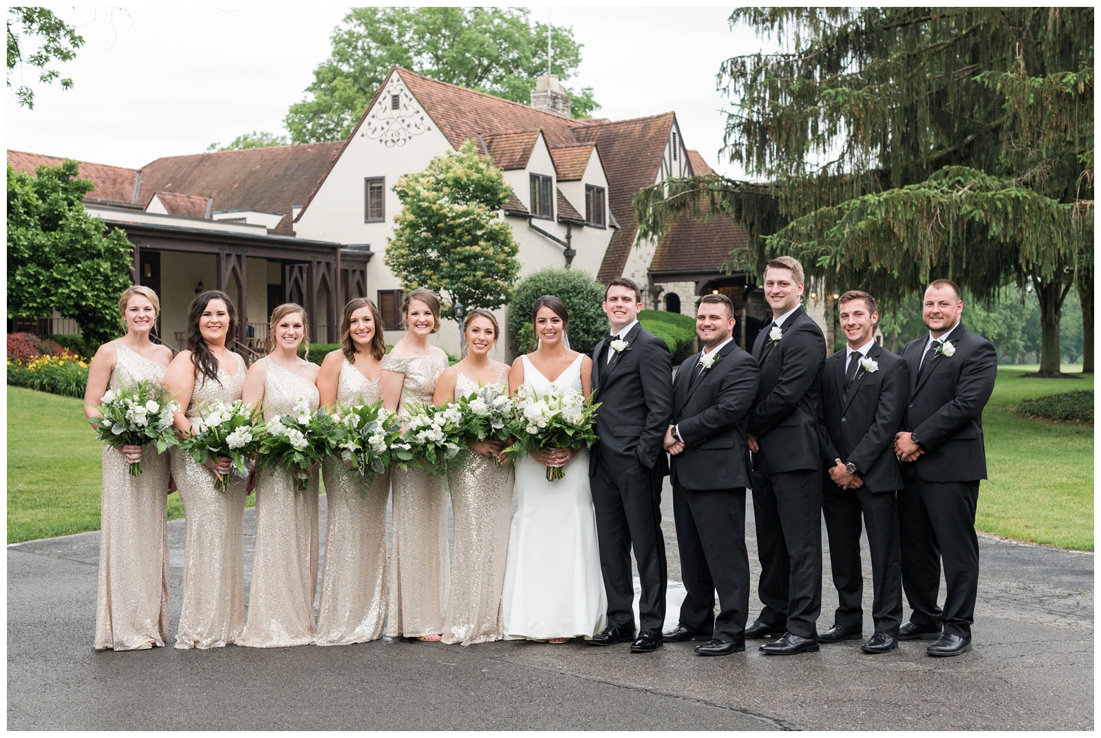 gold and ivory bridal party outfits outside Brookside Golf and Country Club 