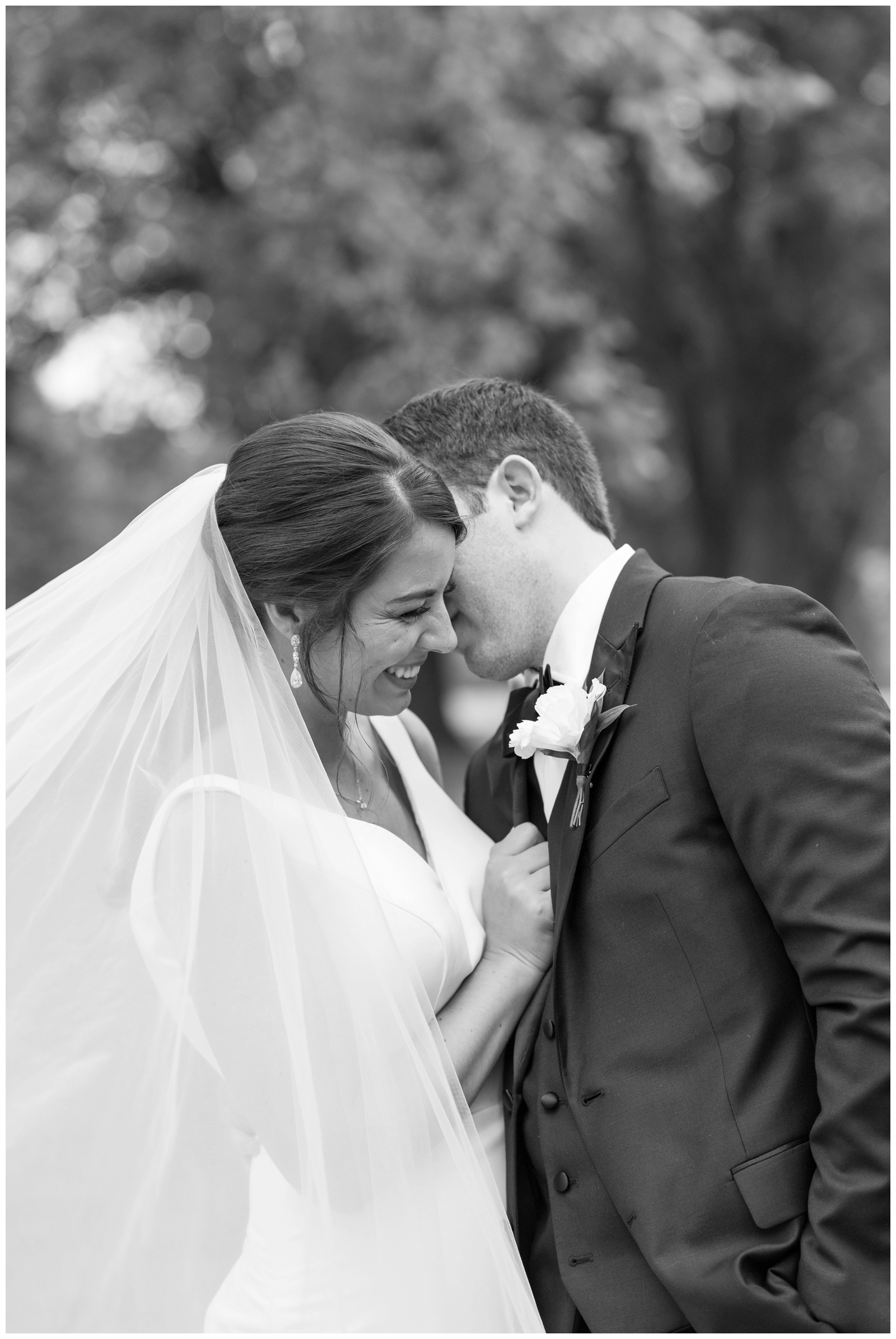 black and white portrait of groom making bride laugh during OH wedding portraits