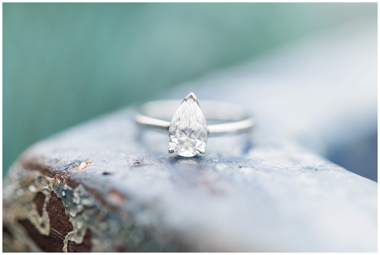 teardrop engagement ring sits on wall at Oakland Nursery photographed by Pipers Photography