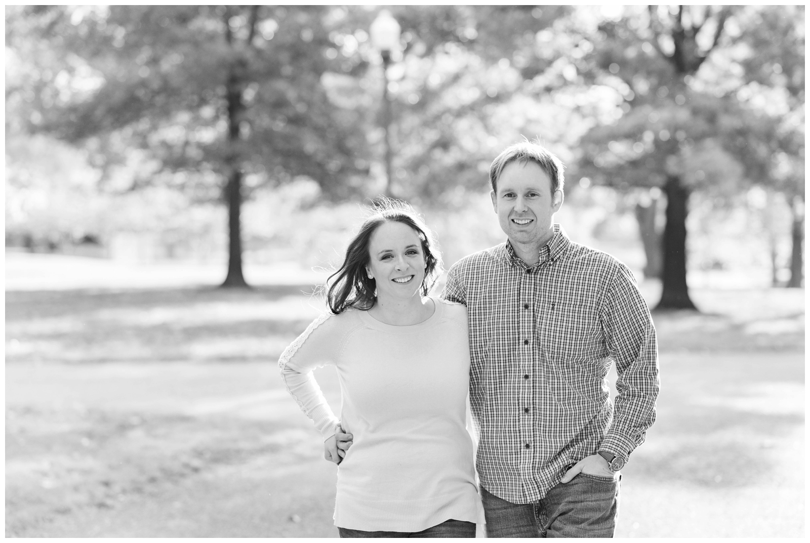 black and white engagement portrait at Franklin Park Conservatory with bride in sweater and groom in button down shirt