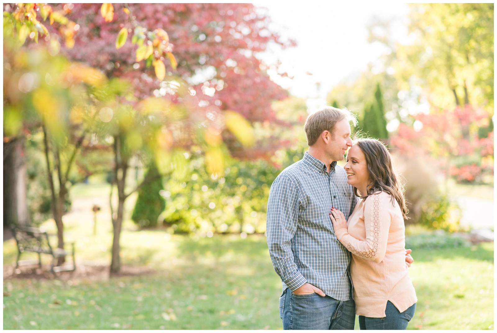 bride and groom to-be laugh during engagement portraits at Franklin Park Conservatory