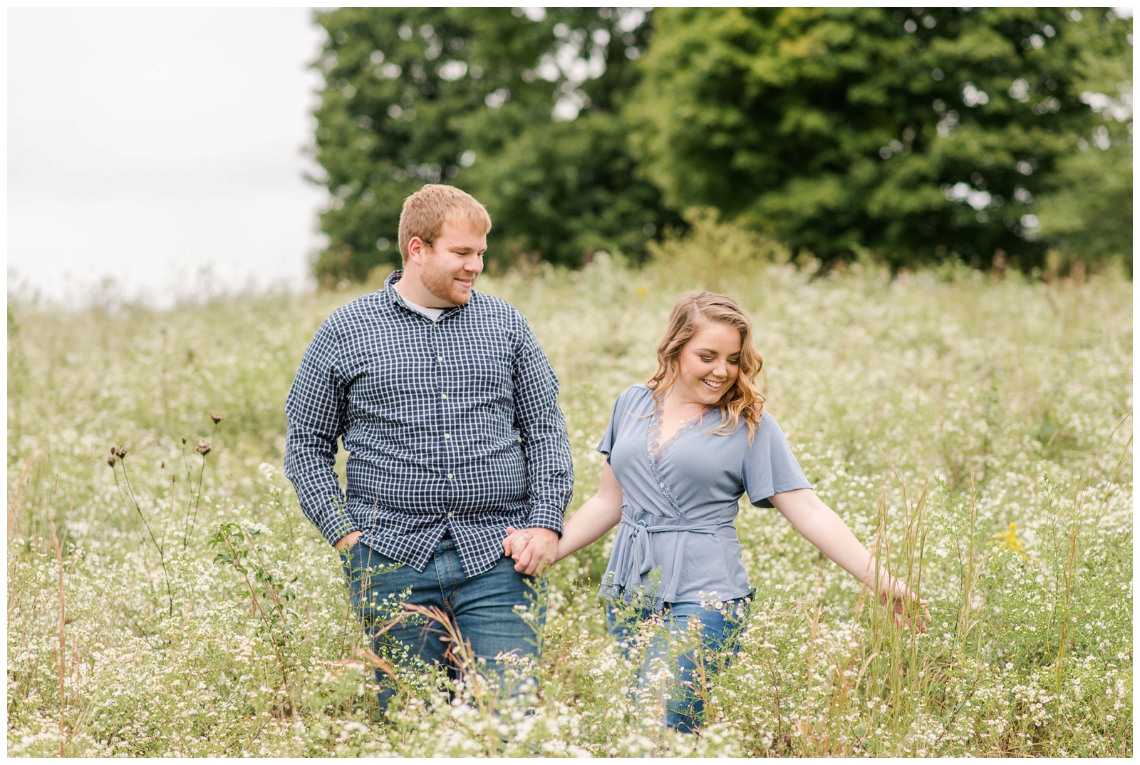 bride to be and groom to be in casual attire for engagement portraits at Dawes Arboretum in Newark OH