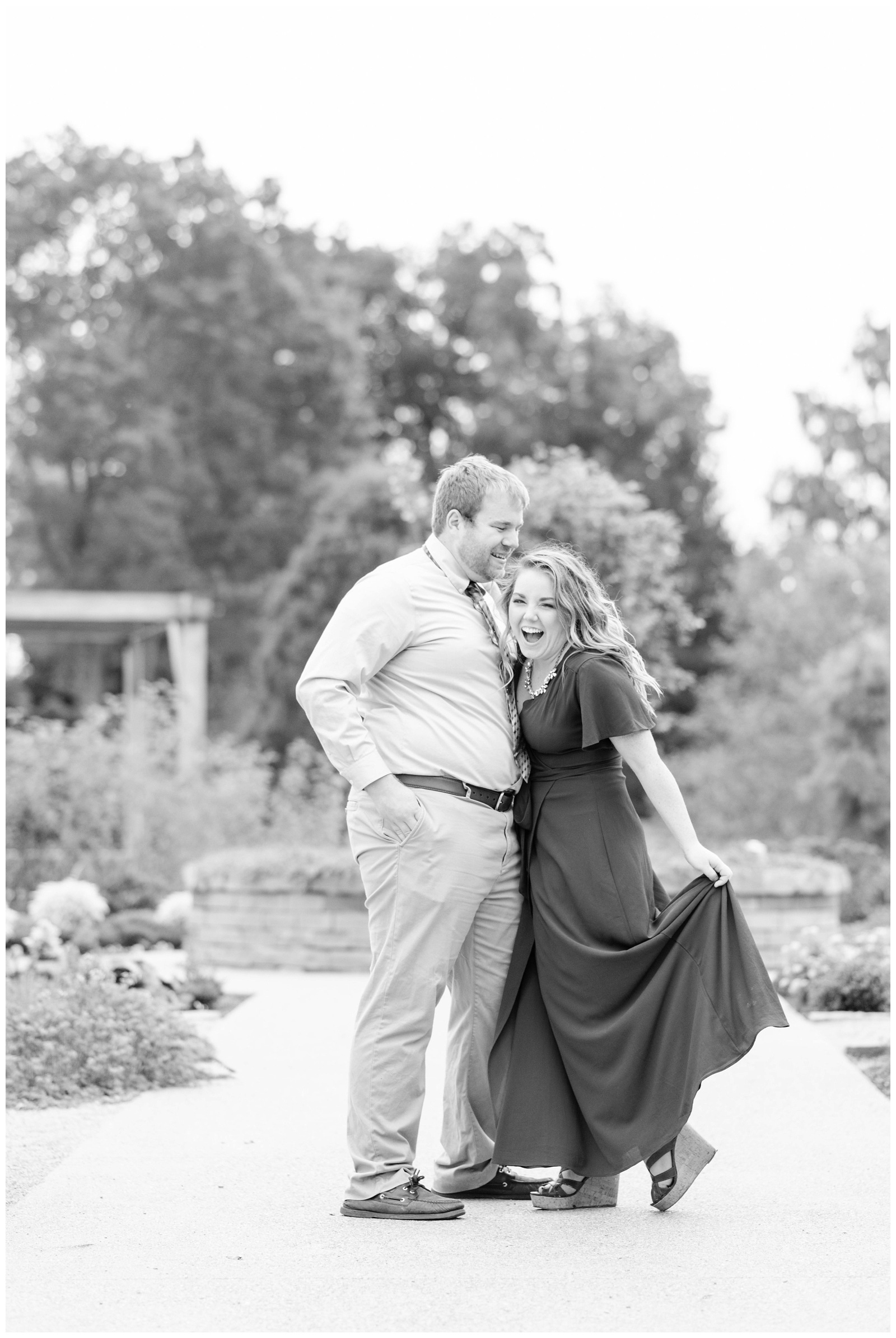 bride and groom laugh while posing for Ohio wedding photographer at Dawes Arboretum
