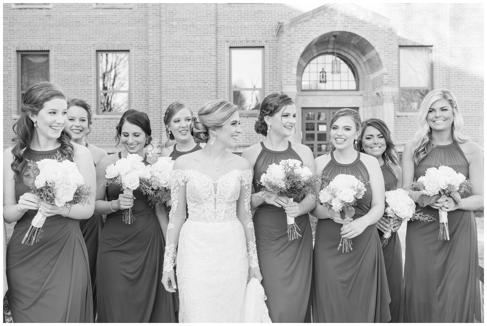 black and white portrait of bridesmaids walking with bride at Ohio wedding