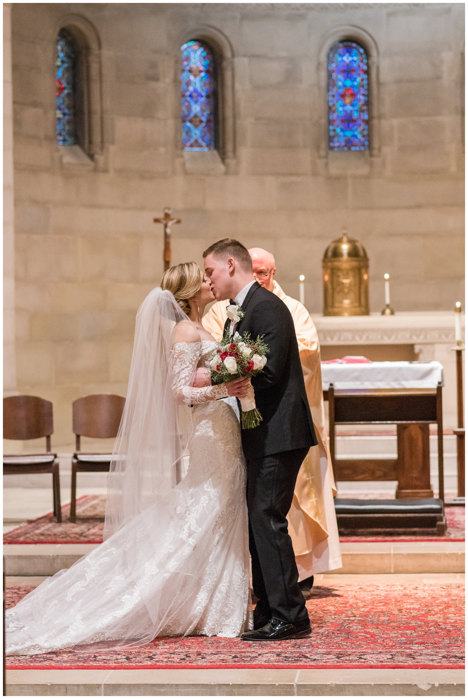 bride and groom kiss after traditional church wedding in Ohio