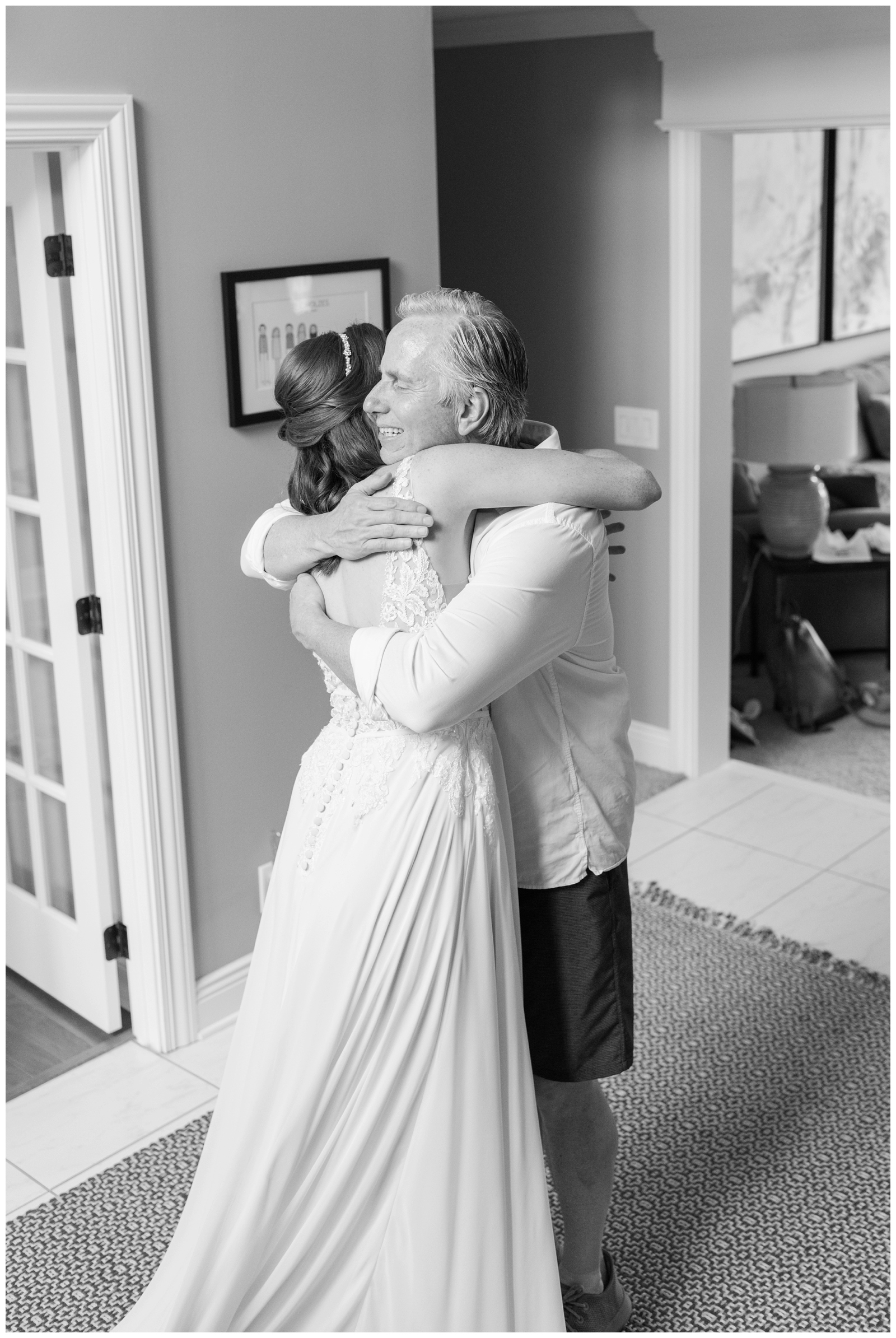 dad hugs bride on Ohio wedding day during first look