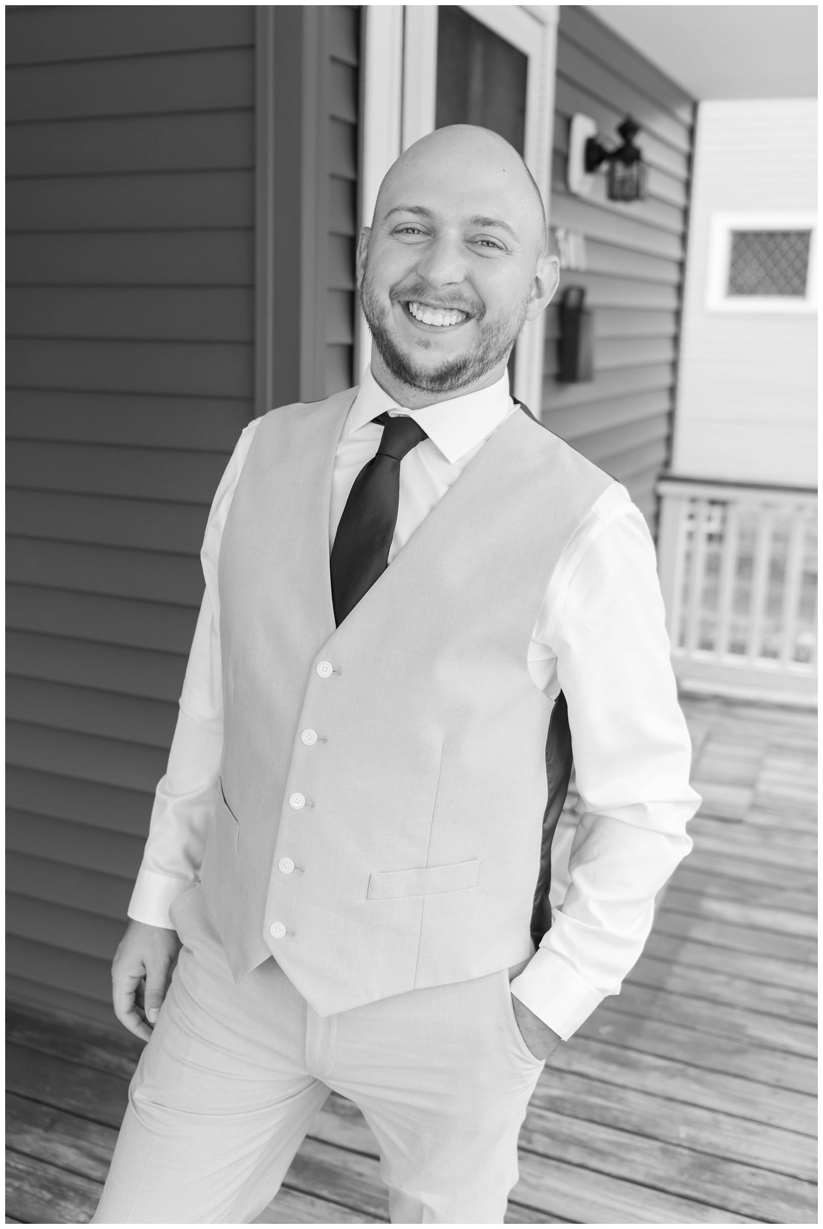 portrait of groom in tan vest outside Ohio home
