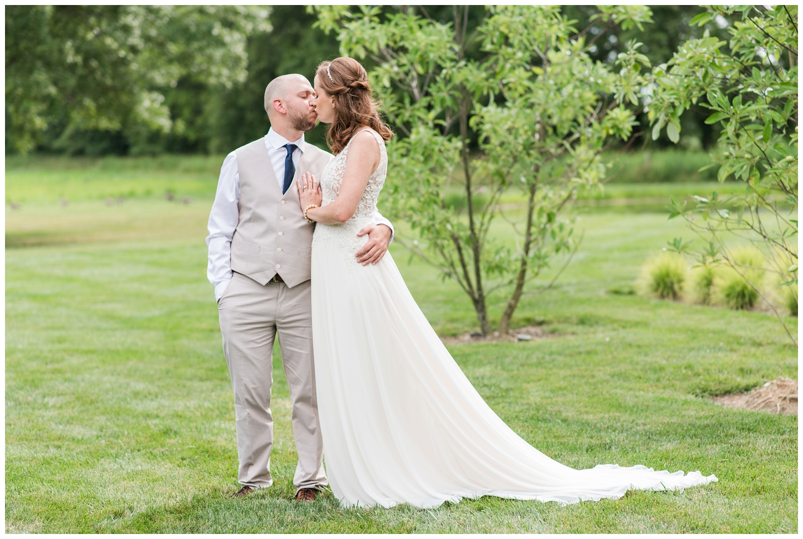 Oak Grove Jorgensen Farms wedding portrait of bride and groom kissing