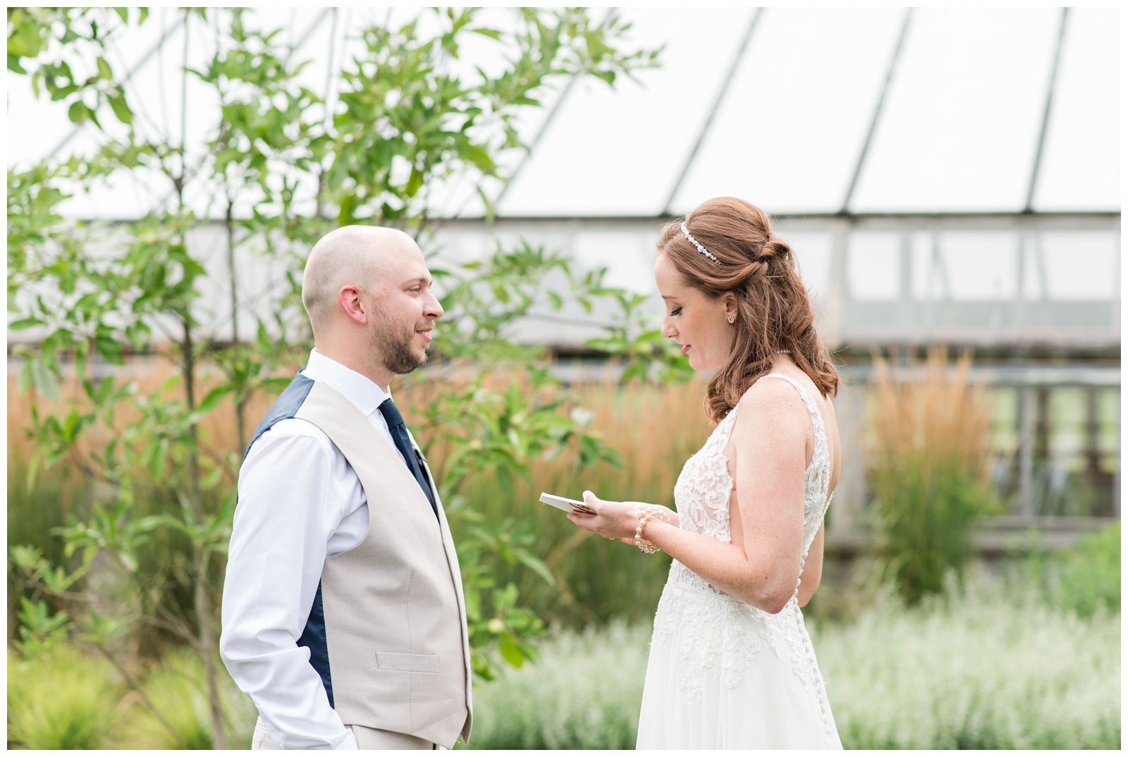 bride reads letter to groom during their first look at Oak Grove Jorgensen Farms