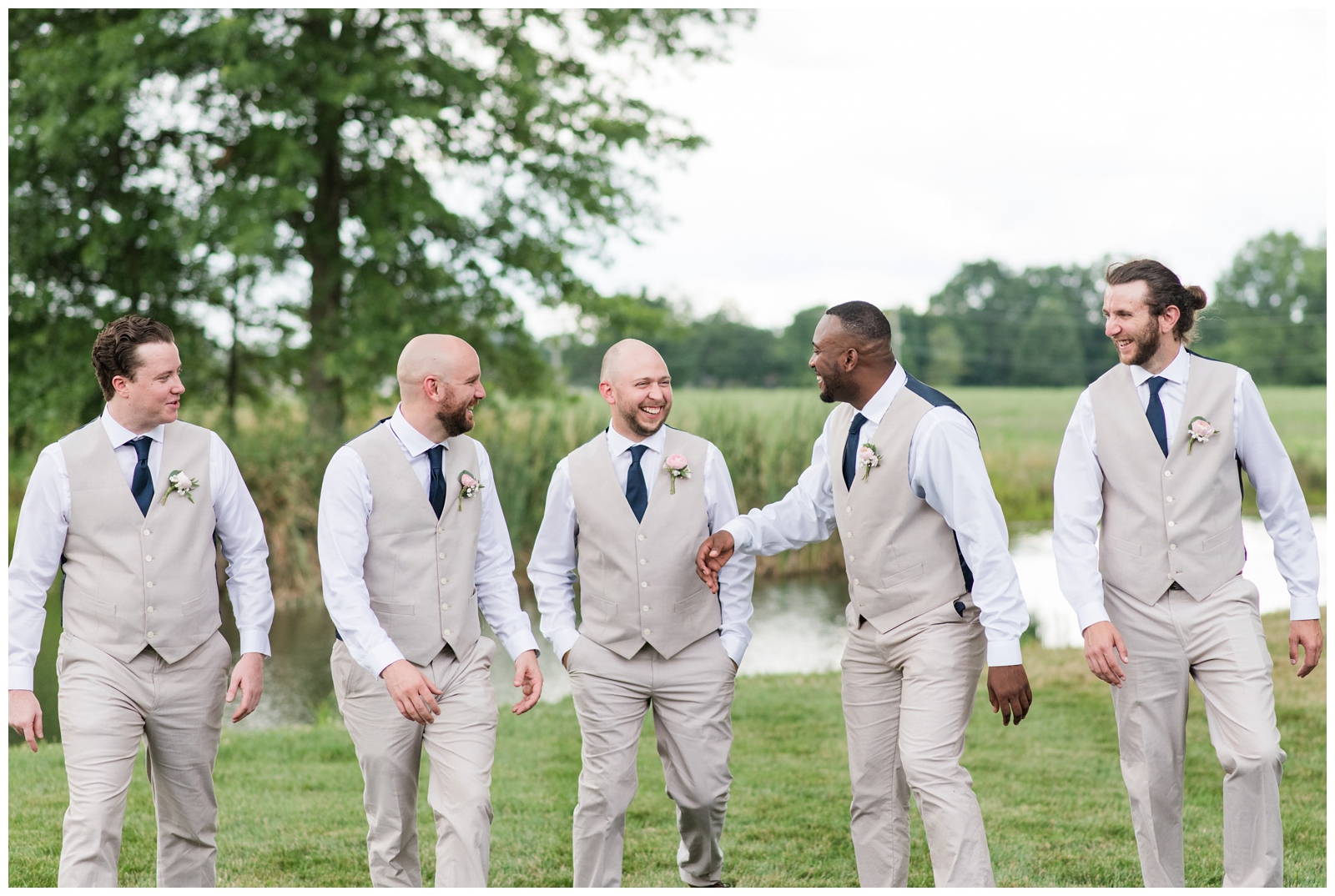 groom and four groomsmen walk together before Oak Grove Jorgensen Farms wedding