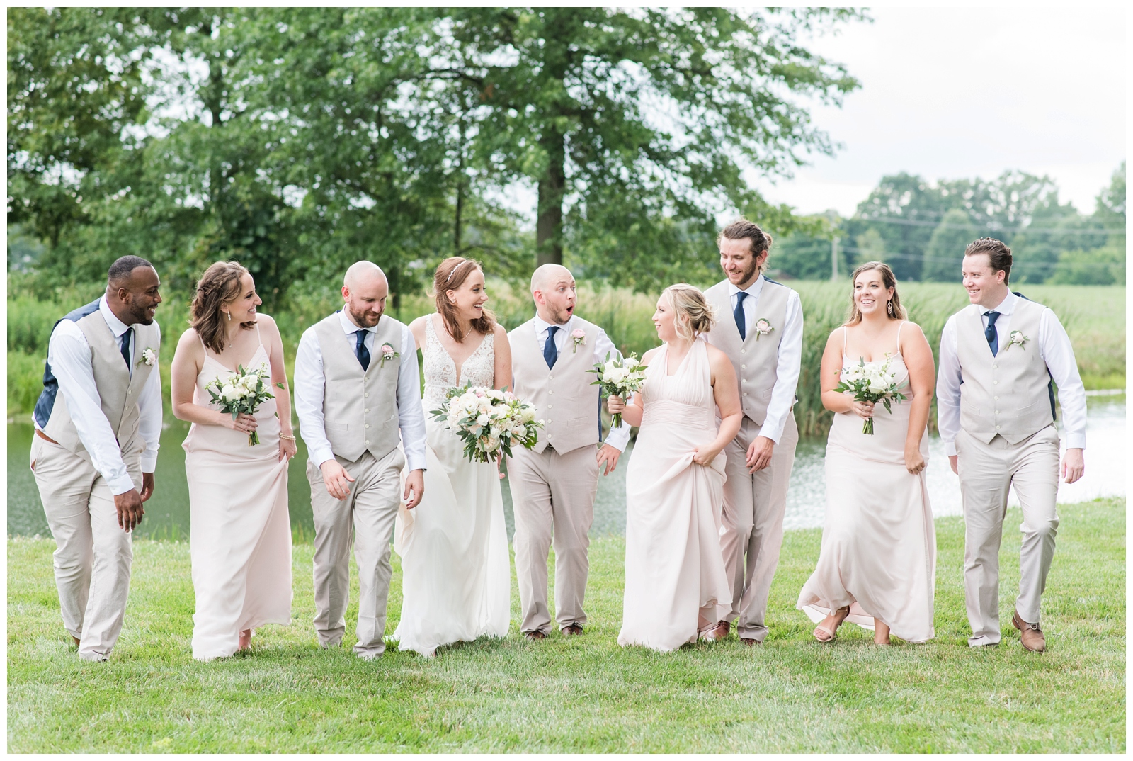 bridal party walks with bride and groom at Oak Grove Jorgensen Farms wedding