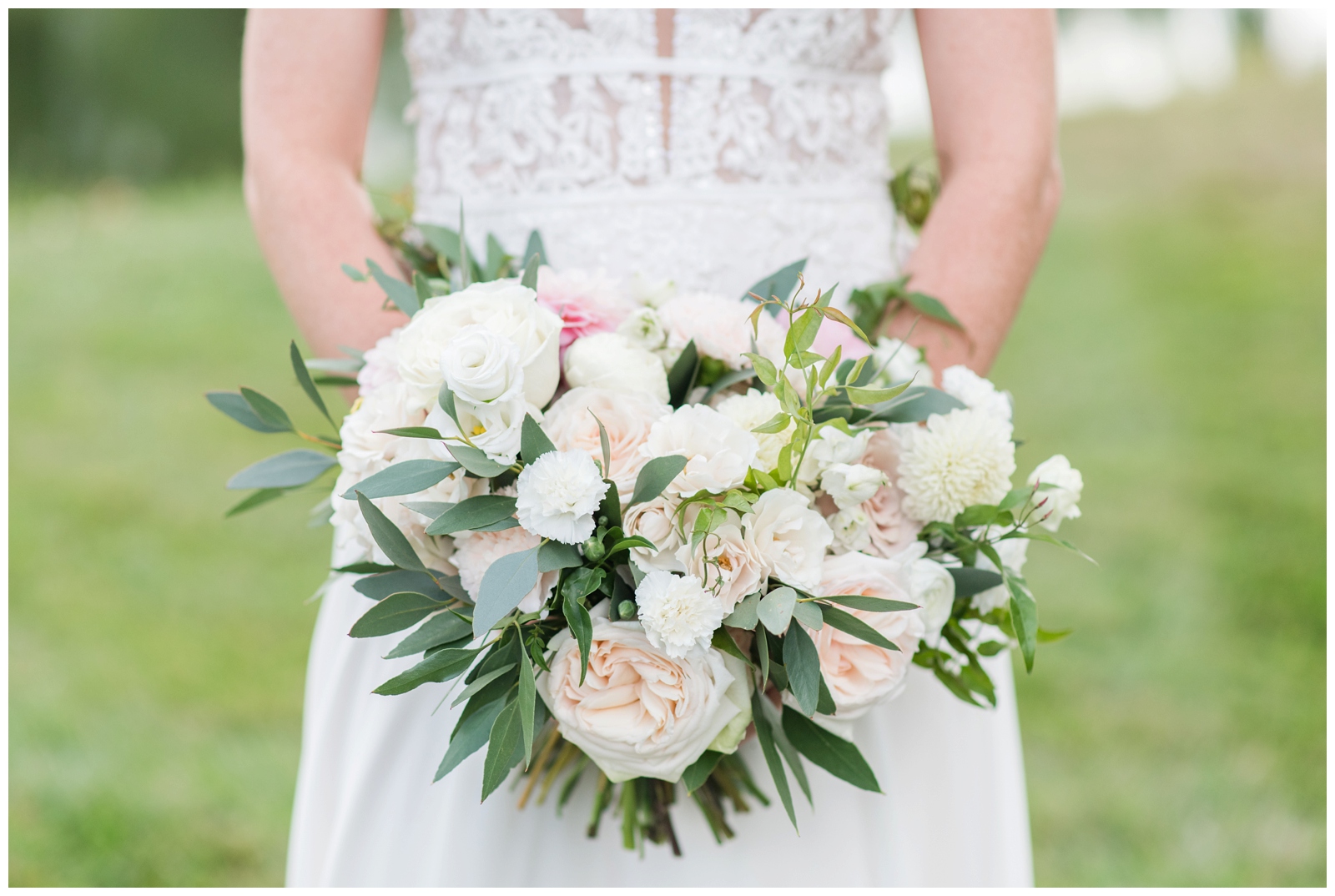 pastel pink and green wedding bouquet held by summer bride in Ohio