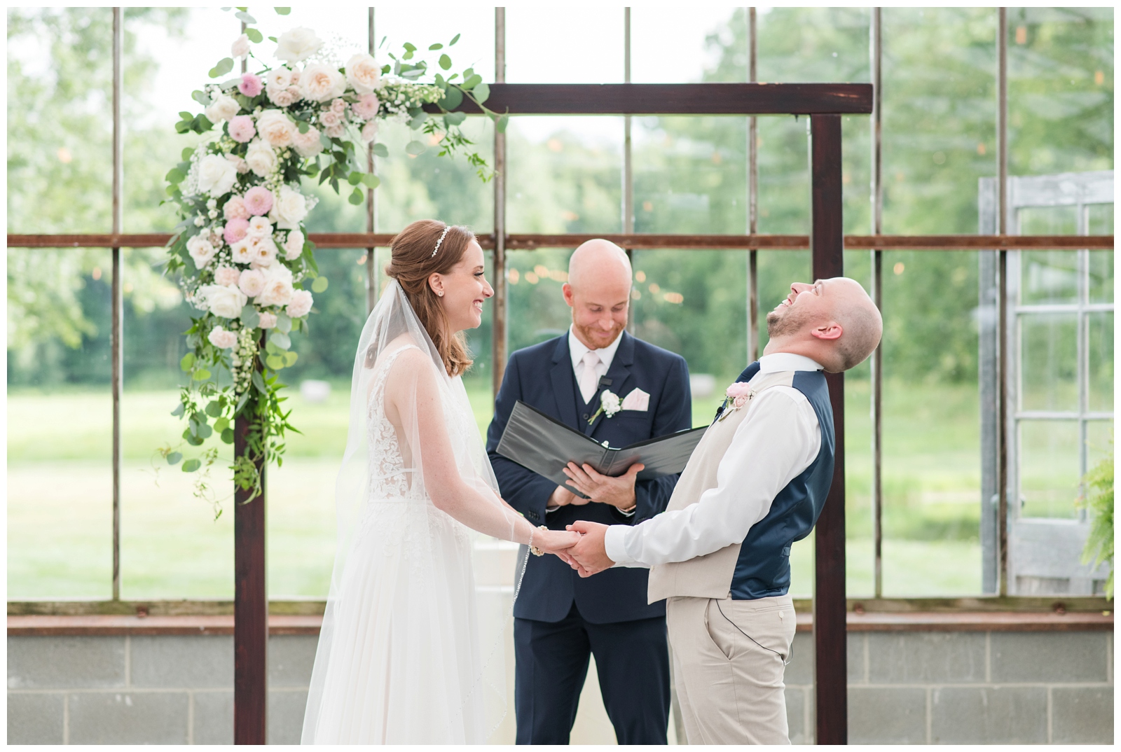groom laughs during wedding vows at Oak Grove Jorgensen Farms