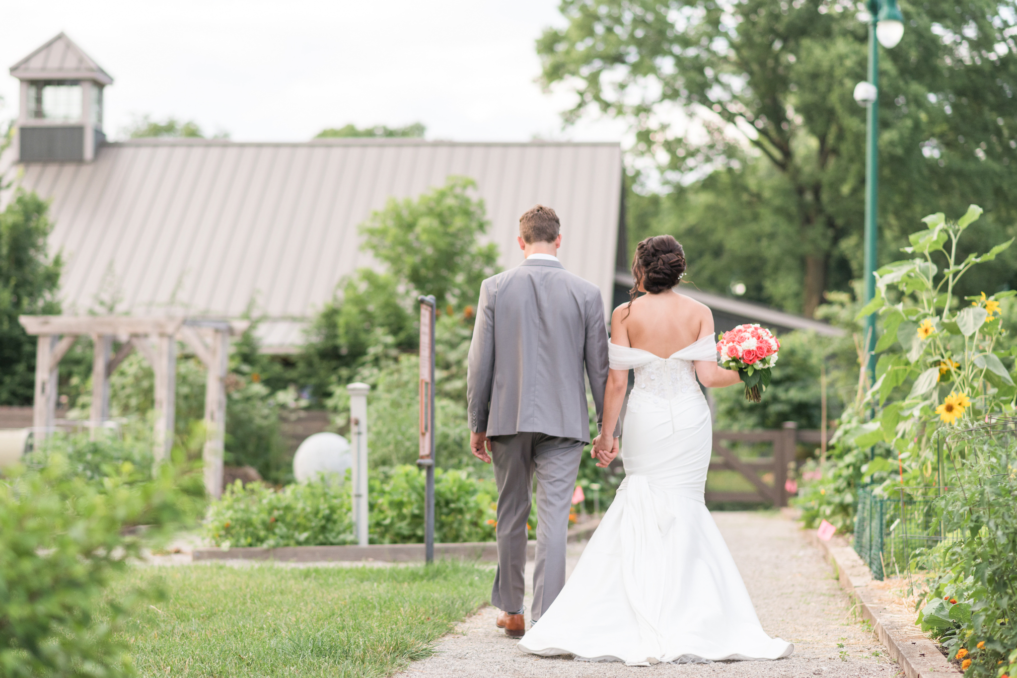 bride and groom walking towards their venue in ohio