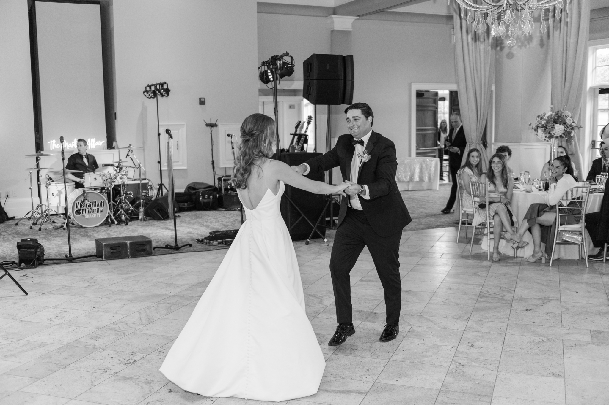 Newlyweds dance with big smiles for the first time at their Pinnacle Golf Club Wedding